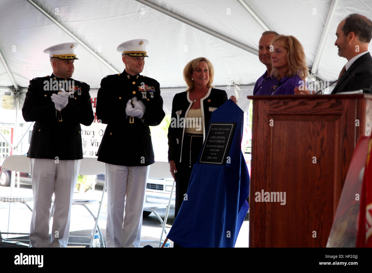 Julie and David Vinnedge are presented a plaque dedicating the