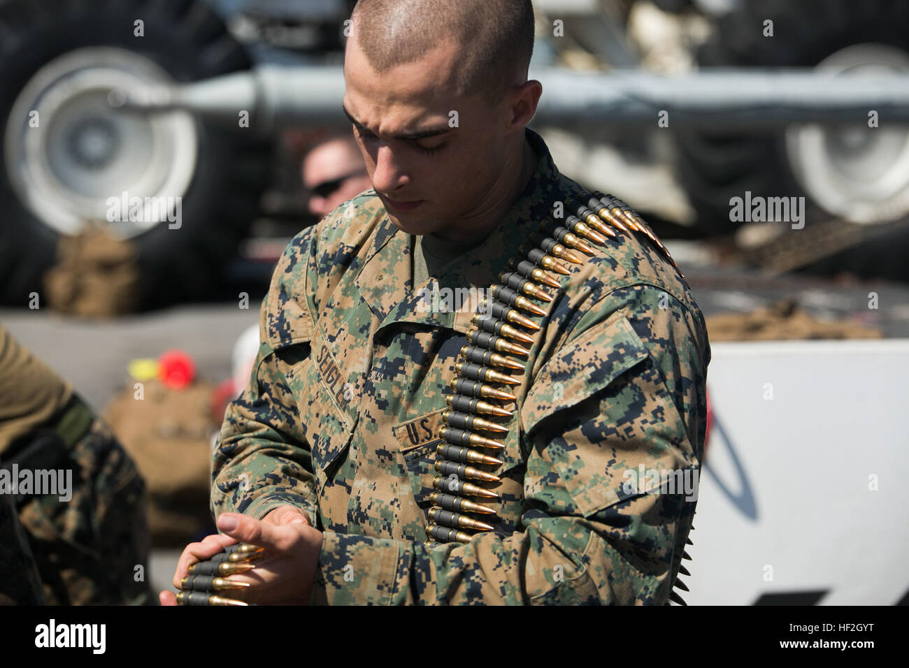 Lance Cpl. Kevin Seigler, a rifleman with Company I, Battalion Landing Team 3rd Battalion, 5th Marines, 31st Marine Expeditionary Unit, counts ammunition for the M240B medium machine gun during a flight-deck during Certification Exercise (CERTEX, Sept. 24, 2014. CERTEX is the final evaluation of the 31st Marine Expeditionary Unit/Peleliu Amphibious Ready Group prior to their regularly-scheduled Fall Patrol of the Asia-Pacific region. (U.S. Marine photo by Lance Cpl. Robert Williams Jr./Released) 31st MEU Fall Patrol 2014 CERTEX 140926-M-EB647-215 Stock Photo