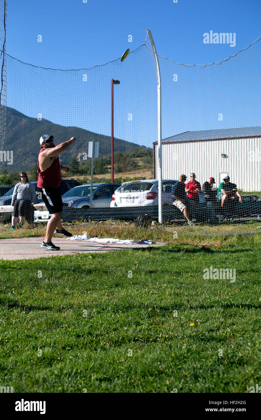 A Marine throws the discus during field practice in Colorado Springs to ...