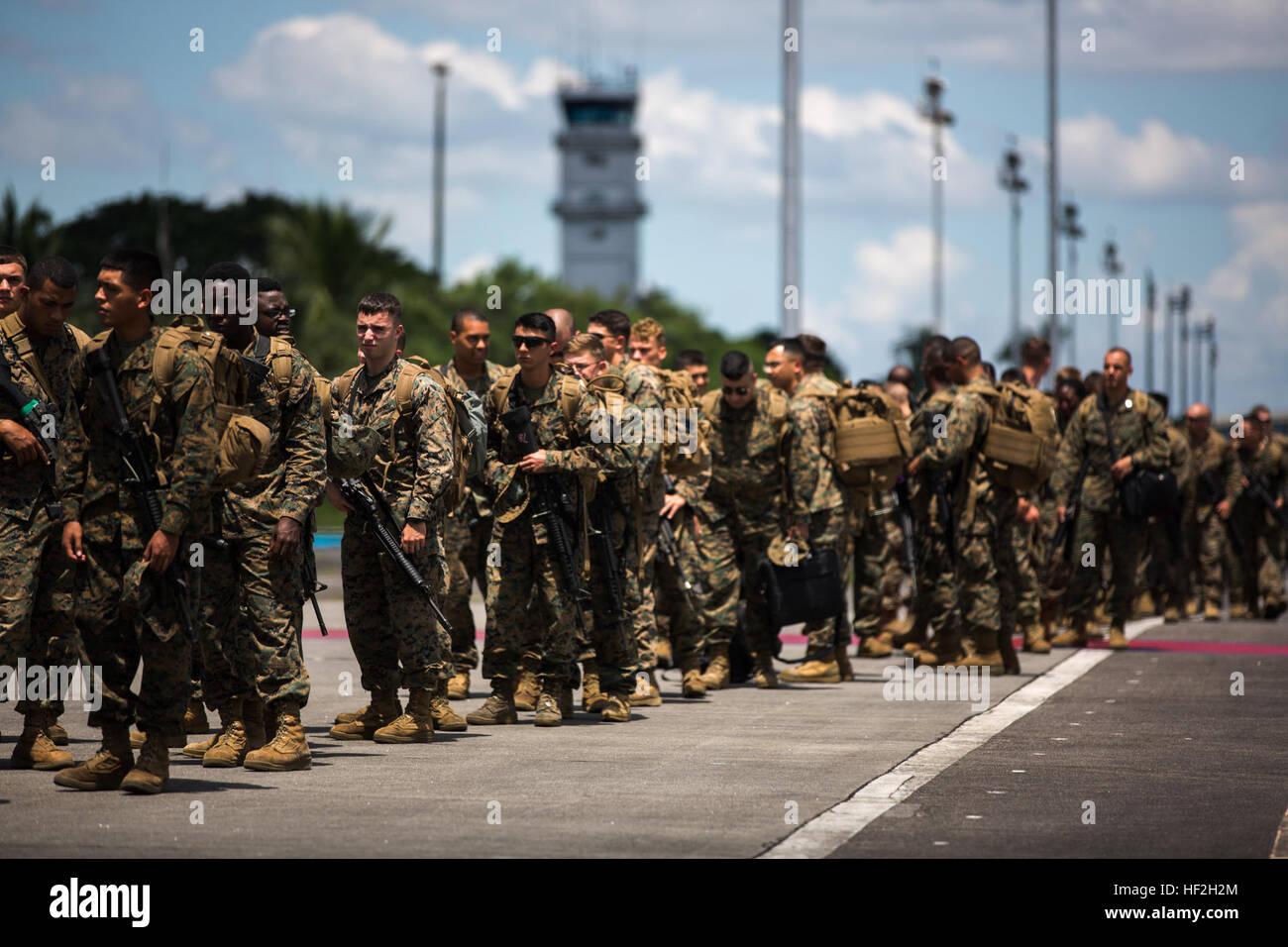 U.S. Marines walk off the runway at Clark Air Base in Pampanga province