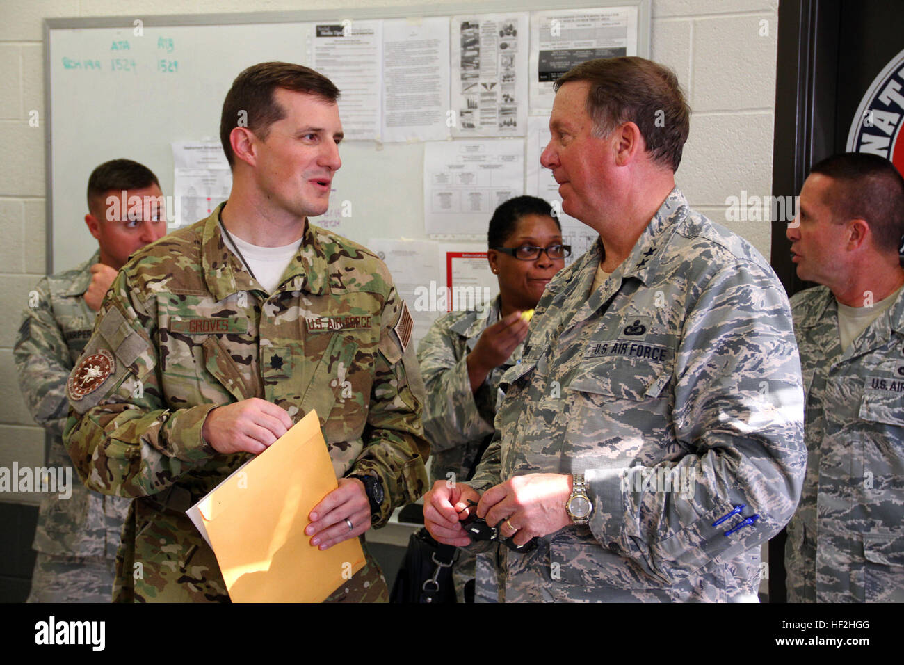 Lt. Col. Matt Groves, commander of the 123rd Contingency Response Group, speaks with Maj. Gen. Edward W. Tonini, Kentucky's adjutant general at the Kentucky Air National Guard Base in Louisville, Ky., Oct. 2, 2014. The 123rd deployed to West Africa to to set up a logistics hub in support of Operation United Assistance. (U.S. Army National Guard photo by Staff Sgt. Scott Raymond) Kentucky Guardsmen deploy to West Africa 141002-Z-GN092-031 Stock Photo