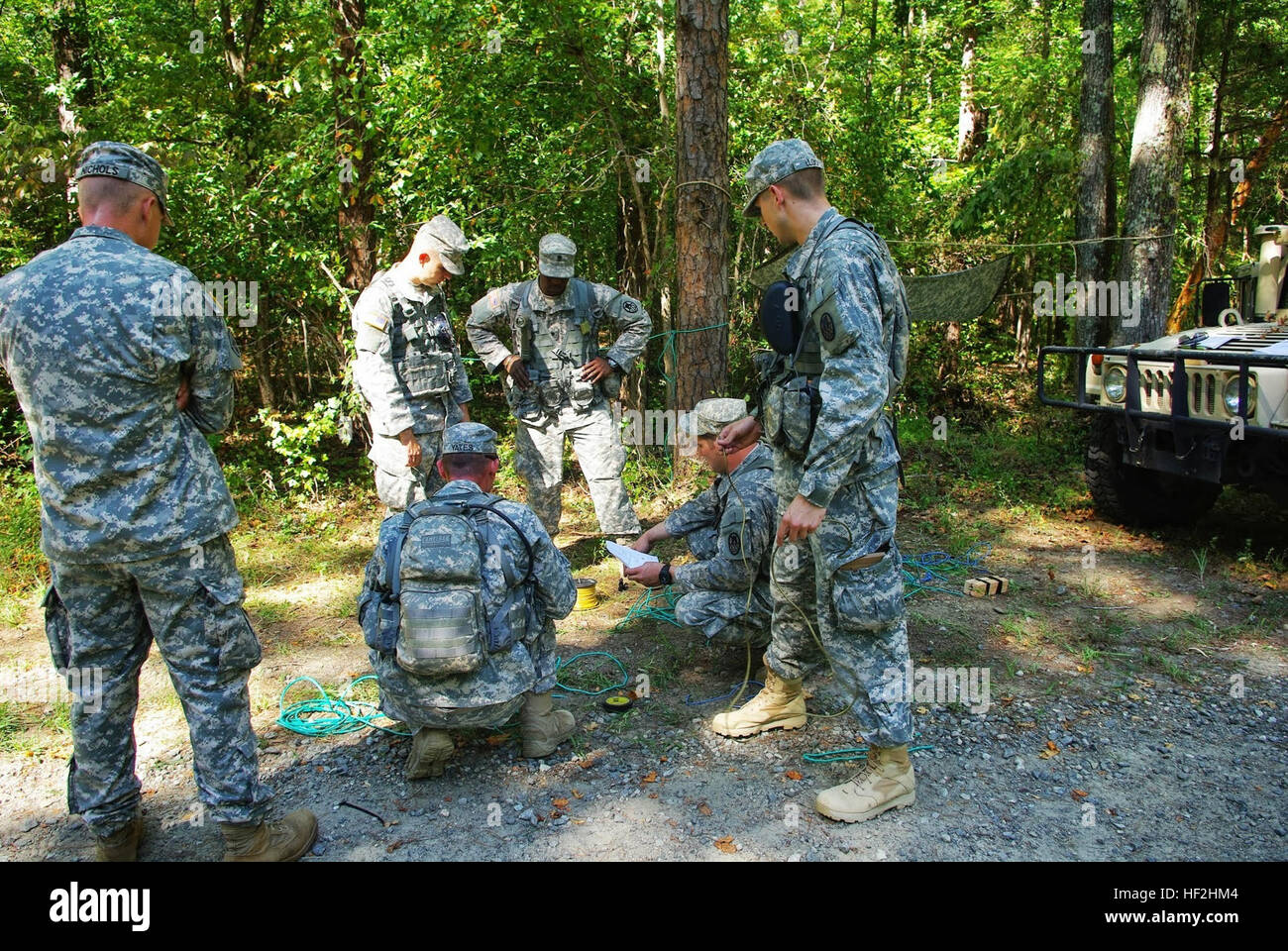 Army Staff Sgt. Andrew Crouse briefs his team on how to build a