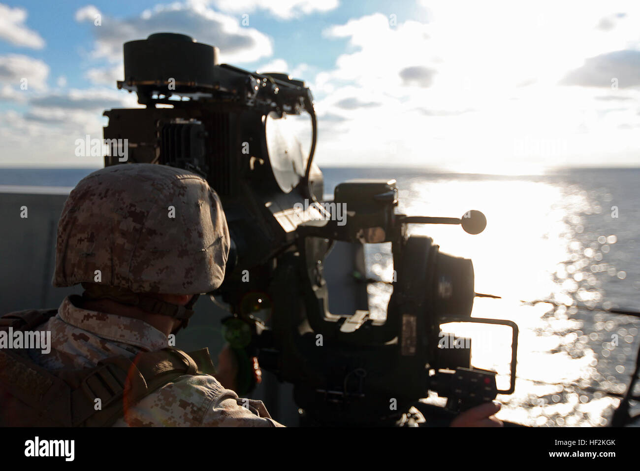 A Marine with Battalion Landing Team 3rd Battalion, 6th Marine Regiment, 24th Marine Expeditionary Unit, looks through an M41A4 Saber System during a simulated strait transit aboard the USS New York, Oct. 24, 2014. Embarked Marines often support amphibious ships during strait transits when the ship is most vulnerable to attack. A contingent of the 24th MEU is embarked aboard the New York during Composite Training Unit Exercise, the MEU’s final training event before their deployment at the end of the year. (U.S. Marine Corps photo by 1st Lt. Joshua W. Larson) A Week at Sea Aboard the USS New Yo Stock Photo
