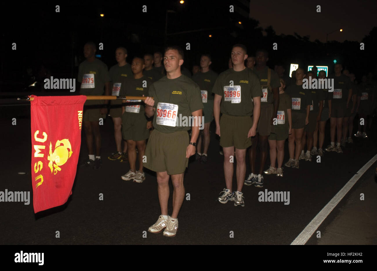 With their guideon extended, representatives from Headquarters Battalion stand ready to run Monday for the 2009 Great Aloha Run. Units from the Army, Navy and local school ROTCs also took part in the military formation division called the Sounds of Freedom. Starting from Aloha Tower in Honolulu, runners followed Nimitz Highway to reach the finish line at Aloha Stadium. Great Aloha Run to kick off on President's Day DVIDS363781 Stock Photo