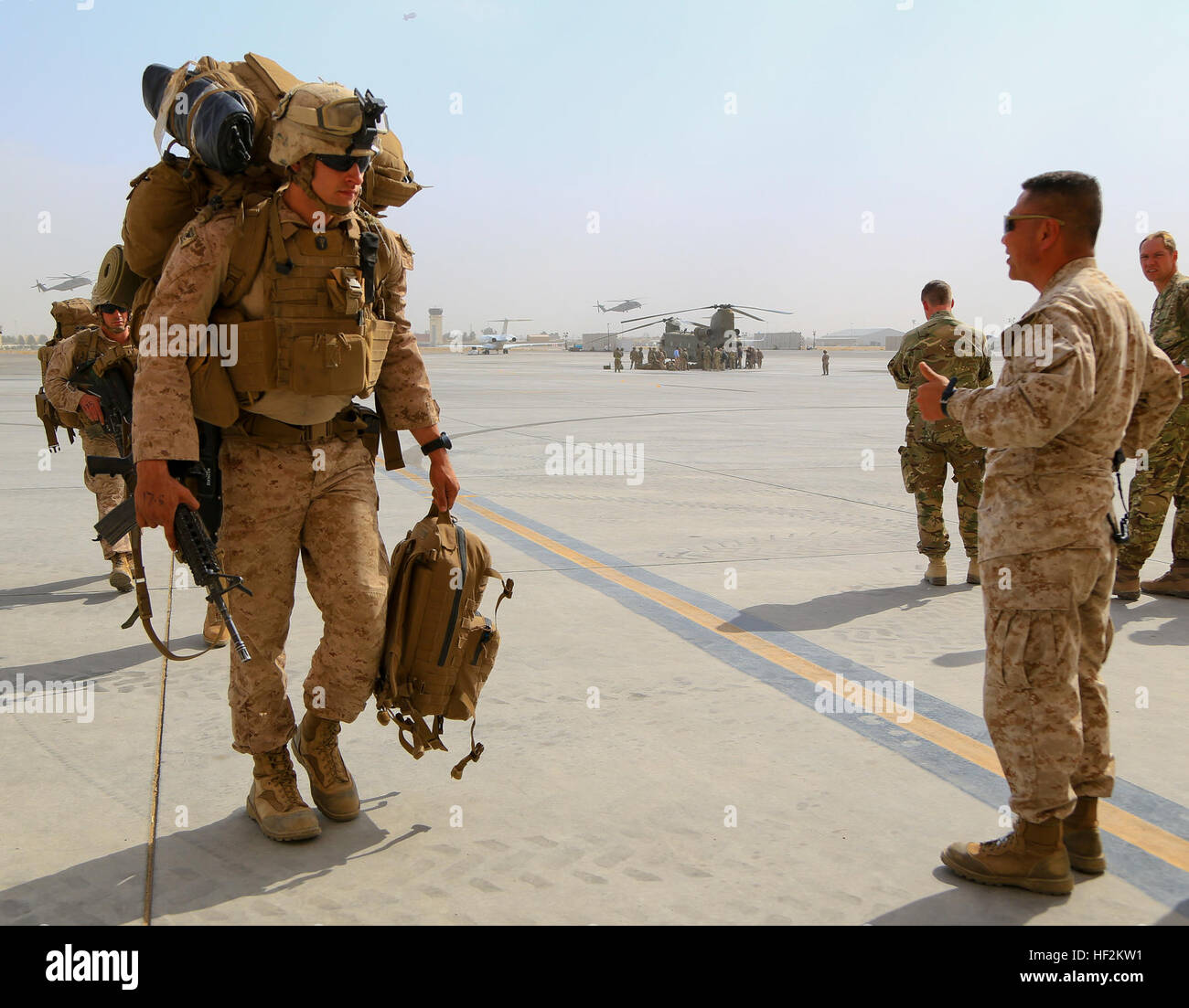 U.S. Marine Brig. Gen. Daniel D. Yoo (right), Regional Command (Southwest) (RC(SW) commanding general, gives Marines a thumbs up after arriving at Kandahar Airfield (KAF), Afghanistan, Oct. 27, 2014. The Marines transitioned to KAF following the end of RC(SW) operations in Helmand province. (Official U. S. Marine Corps photo by Sgt. Dustin D. March/Released) RC(SW) Arrives at Kandahar Airfield 141027-M-EN264-733 Stock Photo