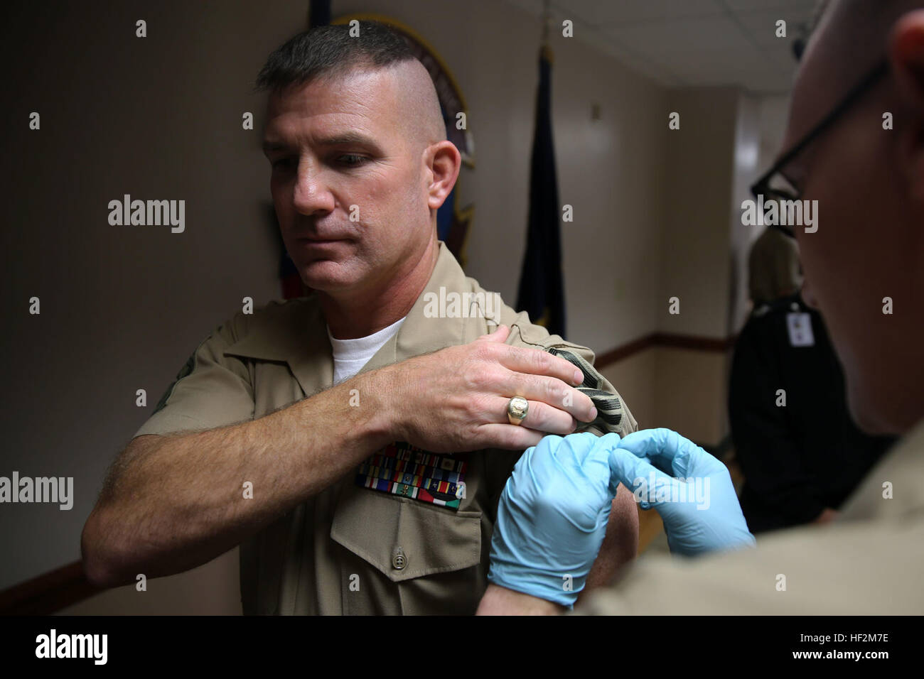 Sgt. Maj. Benjamin L. Pangborn, left, receives his annual flu shot from