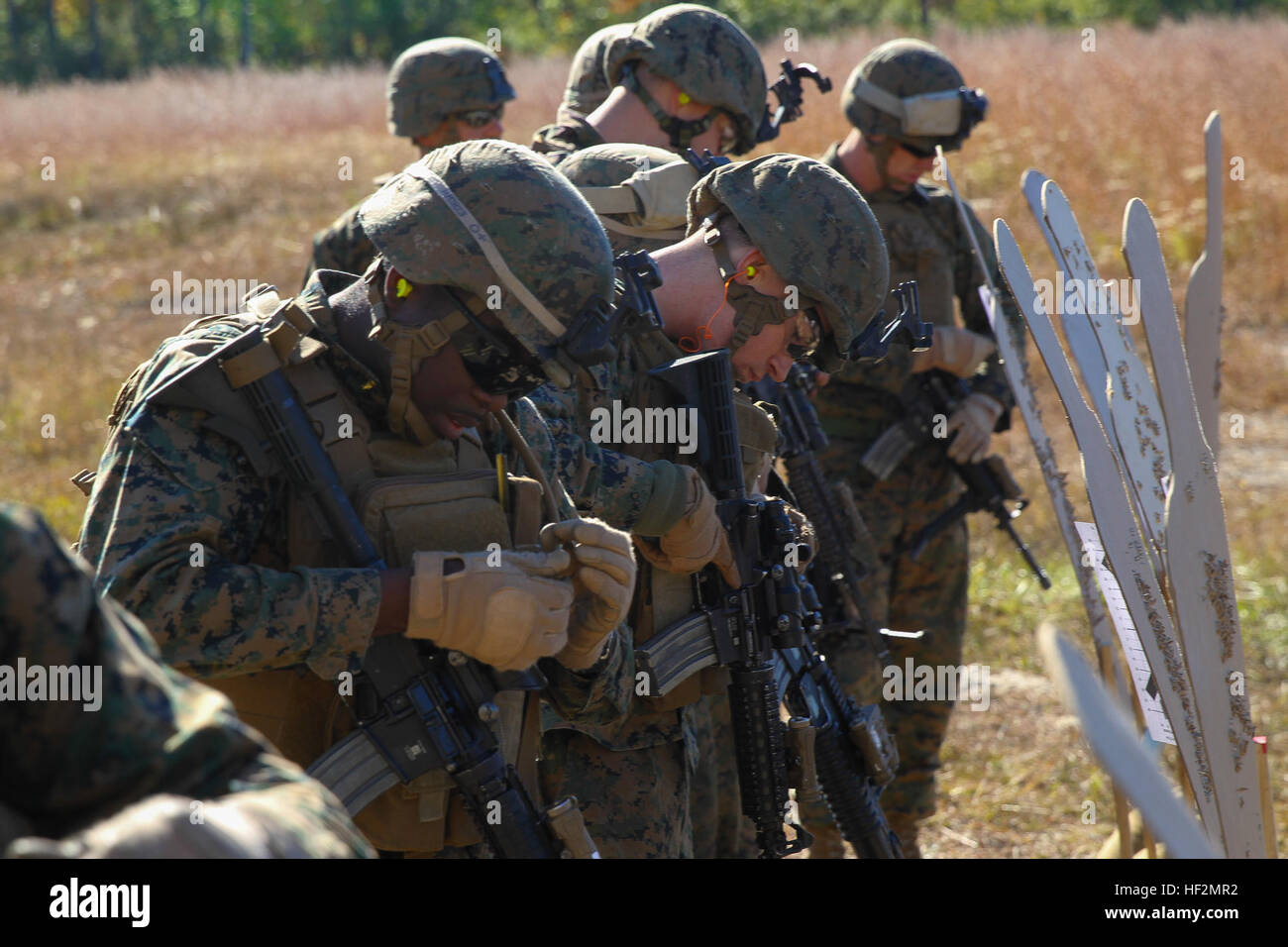 Marines with Bravo Company, Battalion Landing Team 3rd Battalion, 6th Marine Regiment, 24th Marine Expeditionary Unit, review their targets during a weapons calibration exercise at Camp Lejeune, N.C., Nov. 7, 2014. The Marines conducted the training to ensure all weapon systems are working properly and are ready for the upcoming deployment at the end of the year. Bravo Co. is the BLT’s Light Armored Reconnaissance detachment from 2nd Light Armored Reconnaissance Battalion, 2nd Marine Division.  (U.S. Marine Corps photo by Lance Cpl. Austin A. Lewis) 24th MEU's LAR Detachment Shoots for Mission Stock Photo