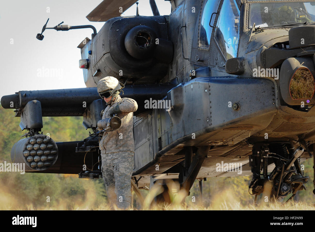 u-s-army-sgt-britany-demichele-92f-petroleum-supply-specialist-for-the-1-130th-attack-reconnaissance-battalion-north-carolina-army-national-guard-refuels-an-ah-64d-apache-at-the-forward-arming-refueling-point-farp-on
