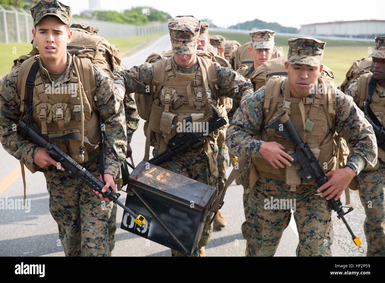 Marines carry a 70pound ammo can during a sixmile hike Dec. 5 at Camp