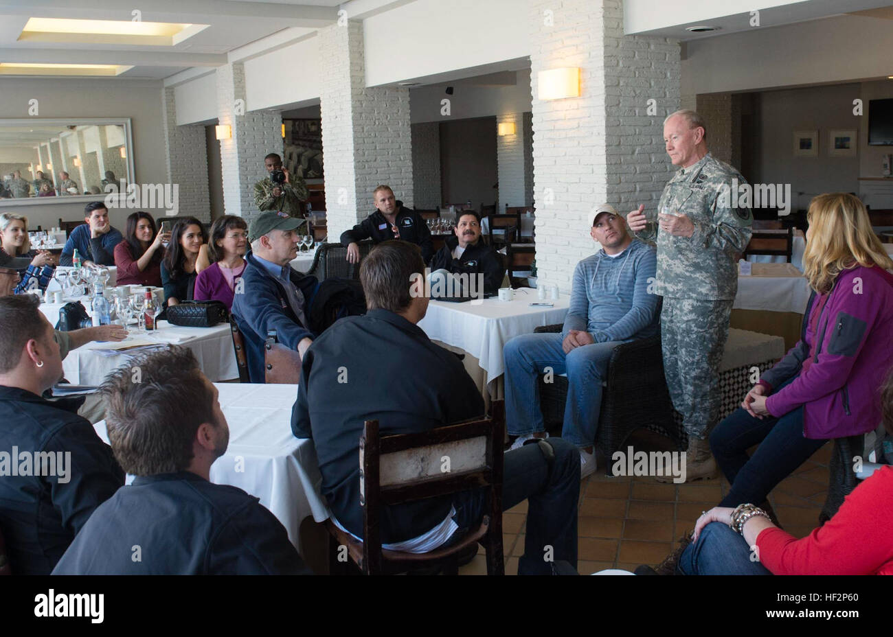 Chairman of the Joint Chiefs of Staff Gen. Martin E. Dempsey talks with USO talent and staff before they all begin their first troop visit and perform their first show of the 2014 Chairman USO Holiday tour in Rota, Spain, Dec. 6, 2014. Country music artist Kellie Pickler, retired Chicago Bear middle linebacker Brian Urlacher, actress Dianna Agron, Deanie Dempsey, Gen. Martin Dempsey, comedian Rob Riggle, actress Meghan Markle, Washington Nationals pitcher Doug Fister and USO President Dr. J.D. Couch are accompanying the Chairman to five different countries where U.S. service members are deploy Stock Photo