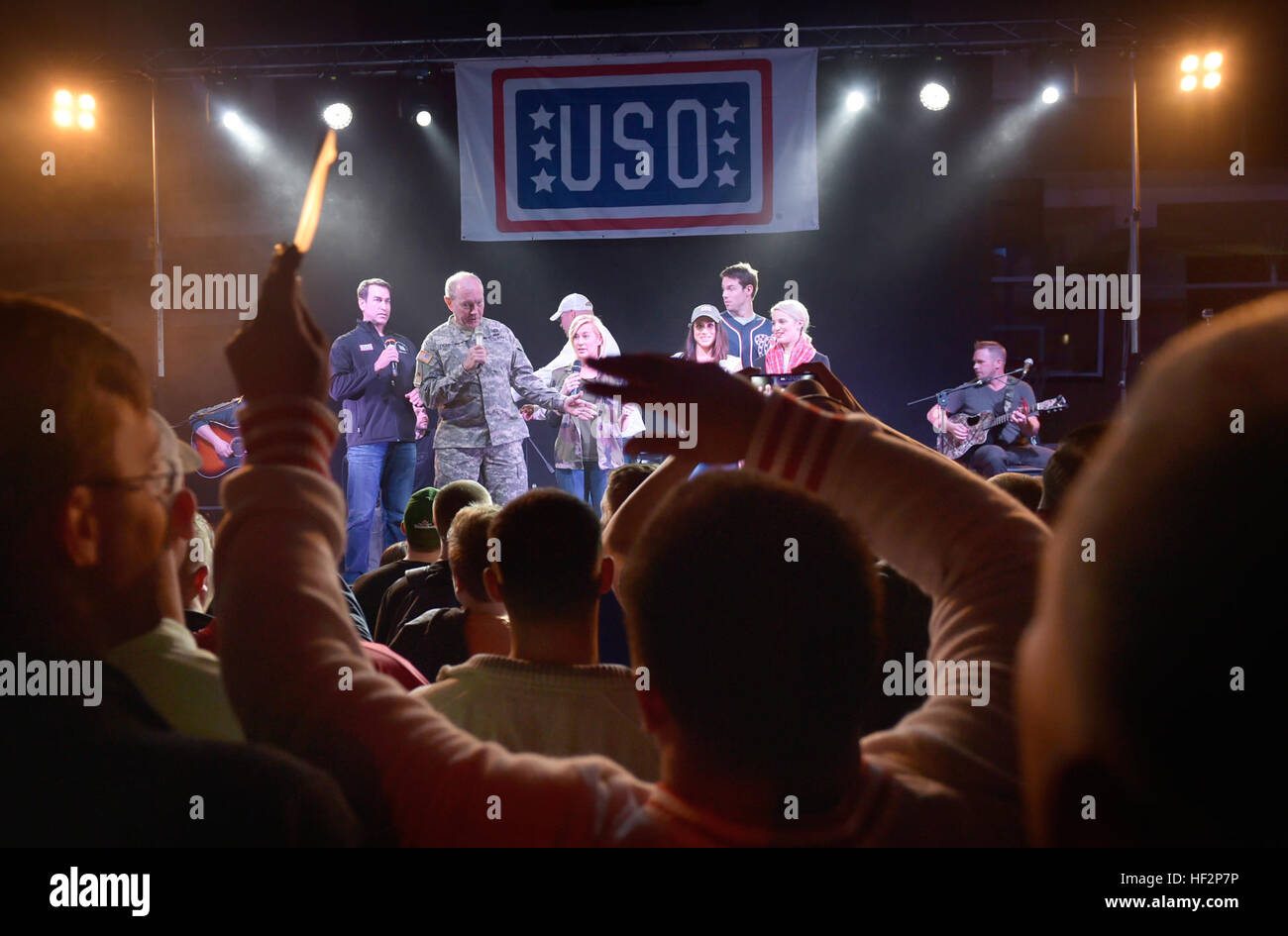 Chairman of the Joint Chiefs of Staff Gen. Martin E. Dempsey, country music artist Kellie Pickler, retired Chicago Bear middle linebacker Brian Urlacher, actress Dianna Agron, Gen Martin Dempsey, comedian Rob Riggle, actress Meghan Markle and Washington Nationals pitcher finish a USO show in Vicenza, Italy, Dec. 7, 2014. (DOD photo by D. Myles Cullen/Released) 2014 CJCS Holiday USO Tour 141207-D-VO565-110 Stock Photo