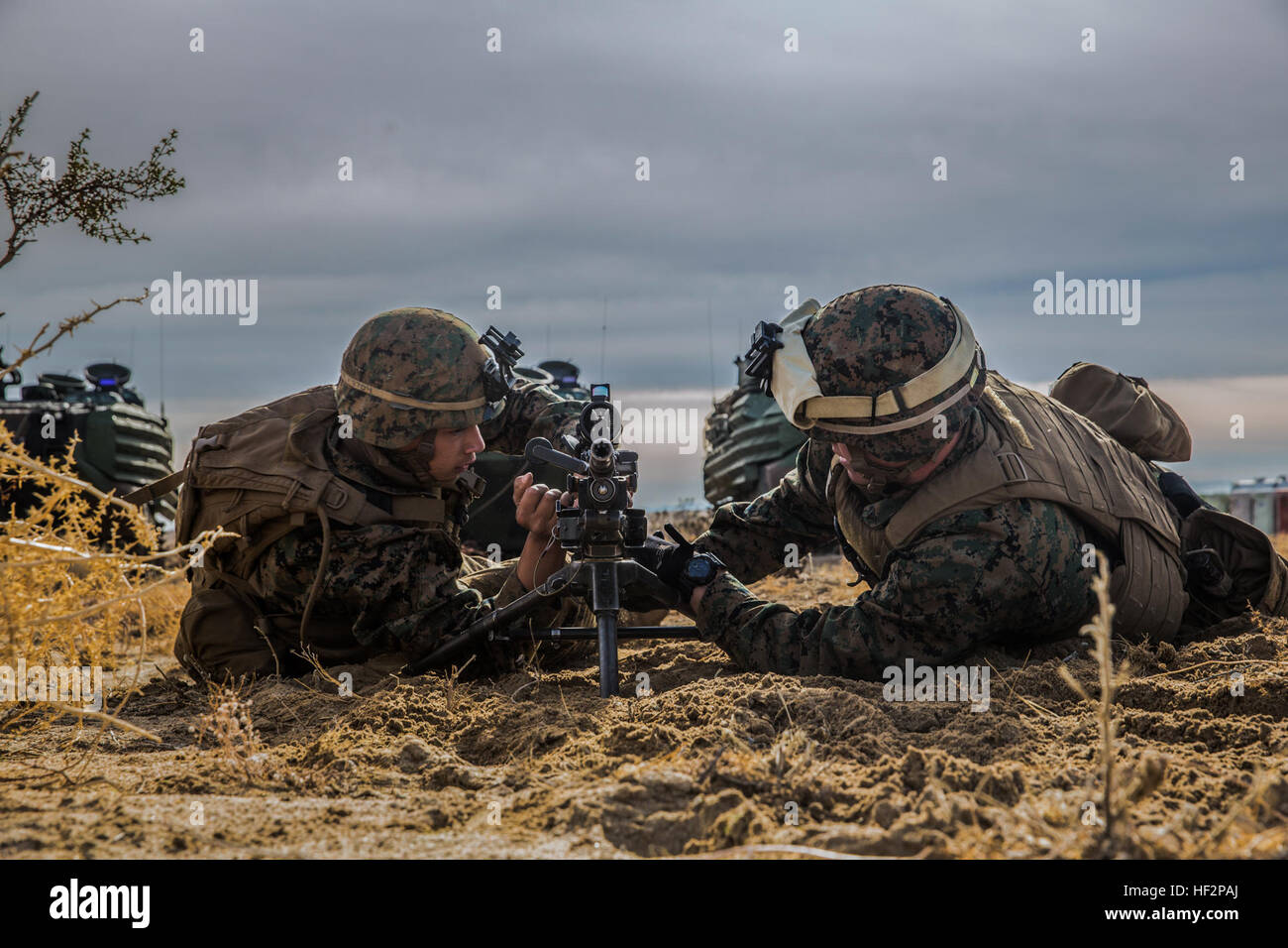 U.S. Marines Lance Cpl. Jalen Freiberg, left, and Lance Cpl. Nicholas Keniston conduct setup rehearsals with an M240B machine gun during a combined arms exercise aboard Marine Corps Air Ground Combat Center, Twentynine Palms, Calif., Dec. 8, 2014. Freiber and Keniston are machine gunners with Battalion Landing Team 3rd Battalion, 1st Marine Regiment, 15th Marine Expeditionary Unit. BLT 3/1 conducted this training concurrent with the 15th MEU’s realistic urban training.  RUT prepares the 15th MEU’s Marines for their upcoming deployment, enhancing their combat skills in environments similar to t Stock Photo