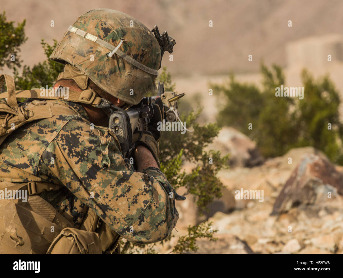 U.S. Marine Lance Cpl. Jonathan Ladowski engages targets during a combined arms exercise aboard Marine Corps Air Ground Combat Center, Twentynine Palms, Calif., Dec. 15, 2014. Ladowski is a rifleman with Battalion Landing Team 3rd Battalion, 1st Marine Regiment, 15th Marine Expeditionary Unit. BLT 3/1 conducted this training concurrent with the 15th MEU’s realistic urban training.  RUT prepares the 15th MEU’s Marines for their upcoming deployment, enhancing their combat skills in environments similar to those they may find in future missions. (U.S. Marine Corps Photo by Sgt. Emmanuel Ramos/Rel Stock Photo