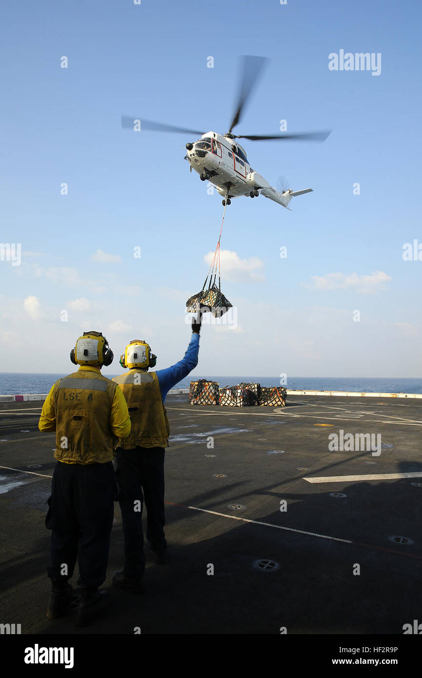 An AS332 Super Puma utility helicopter delivers supplies to the flight ...