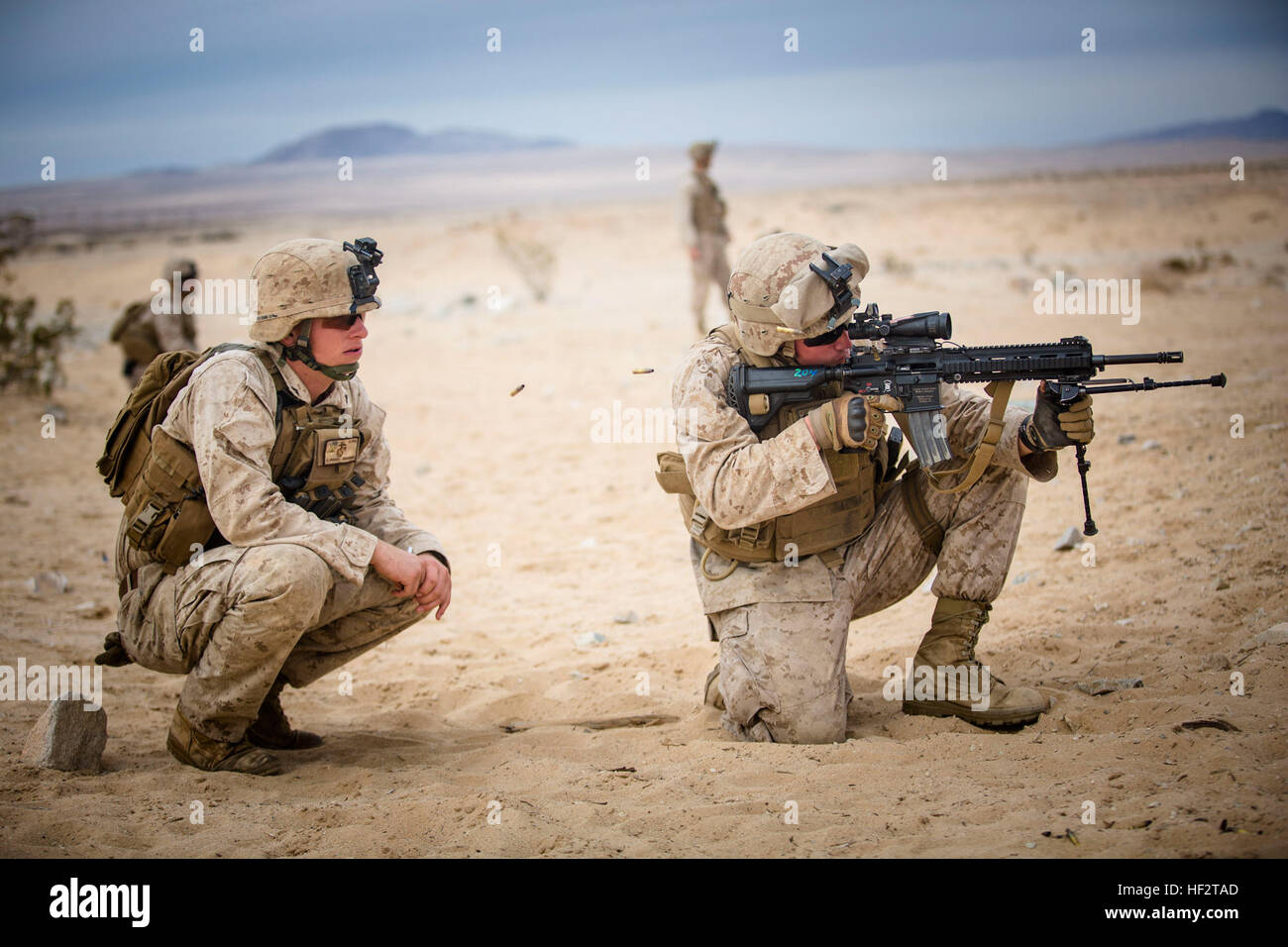 U.S. Navy HM3 Jordan A. Kopf (right), a corpsman assigned to Fox ...