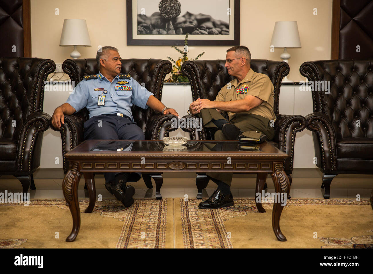 Brigadier Gen. C. J. Mahoney, deputy commander of U.S. Marine Corps Forces, Pacific (right), and Royal Malaysian Air Force Maj. Gen. Dato' Kamalruzaman Mohd Othman assistant chief of staff of the Defence Planning Division of the Malaysian Armed Forces, discuss Bersama Warrior 2015 moments before the exercise's opening ceremony at the Malaysian Armed Forces Headquarters, in Kuala Lumpur, Malaysia, Jan. 22, 2015. The leaders later spoke during the opening ceremony and explained their expectations for the exercise, which is aimed at utilizing combined planning groups to help solve real world scen Stock Photo