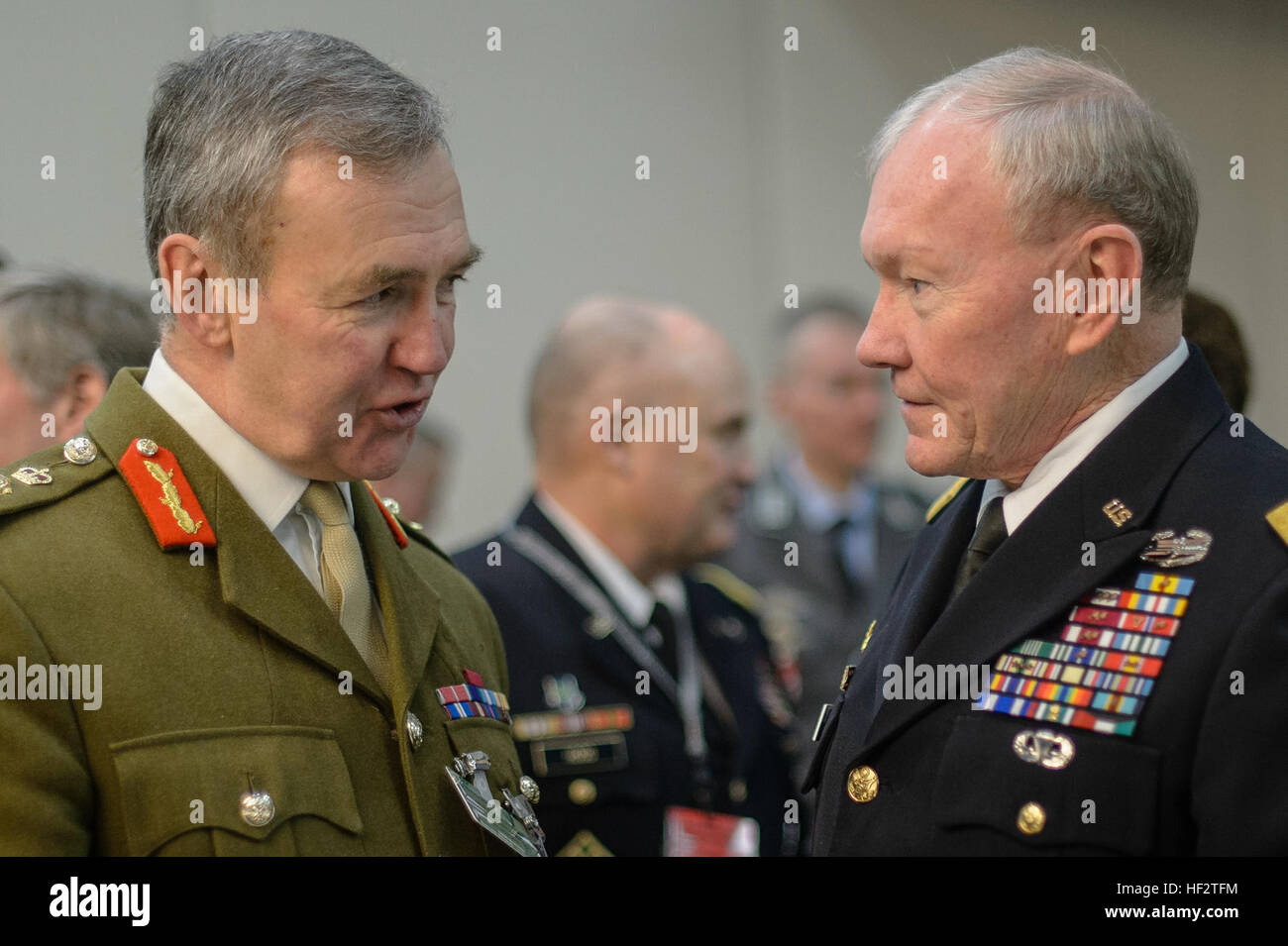 U.K. Gen. Sir Nicholas Houghton, British chief of defense, and U.S. Army Gen. Martin E. Dempsey, chairman of the Joint Chiefs of Staff, talk in-between meetings of the NATO Military Committee in Brussels, Belgium, Jan. 22, 2015. (DOD photo by D. Myles Cullen/Released) CJCS at NATO MCCS 150122-D-VO565-002 Stock Photo