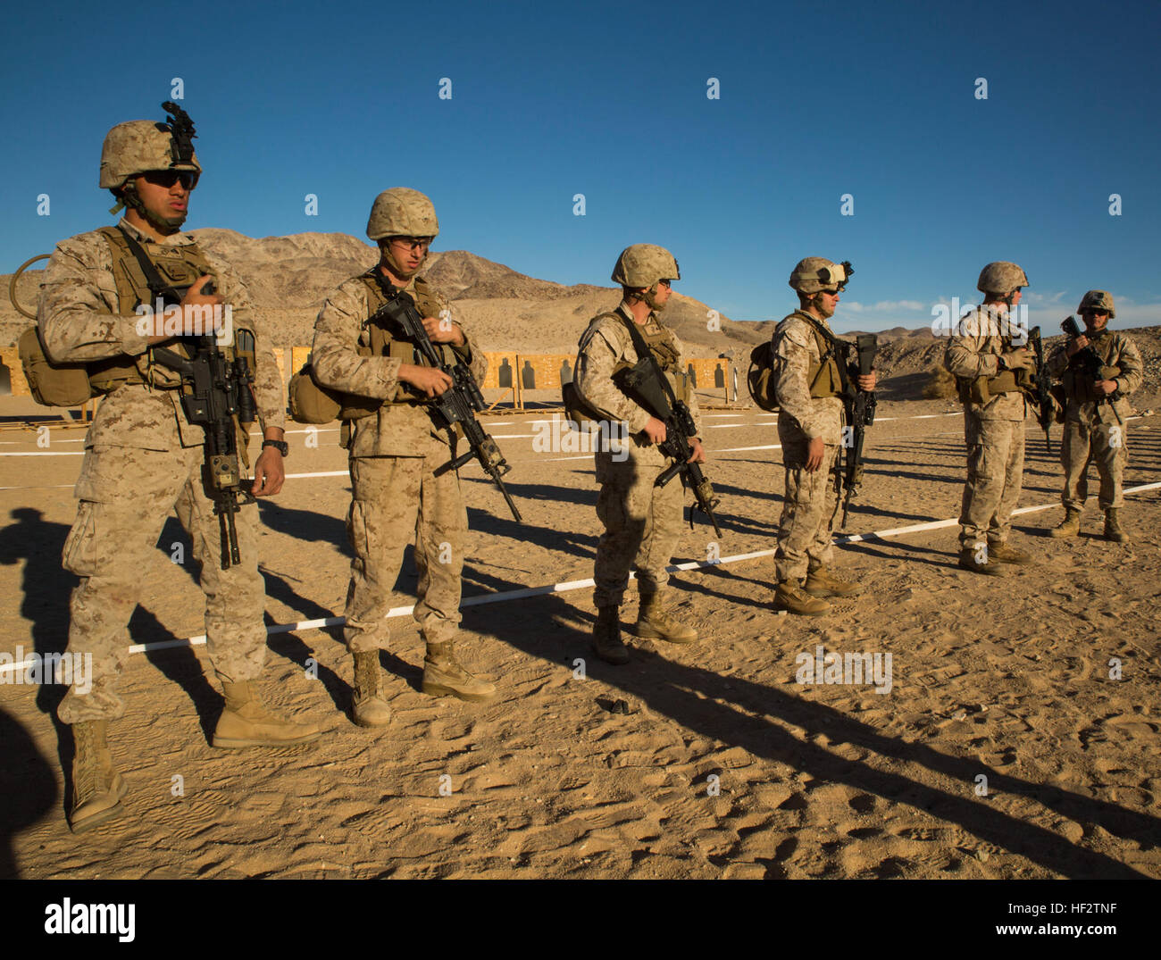 Marines face uprange as a safety precaution, prior to firing table three alpha (rifle course