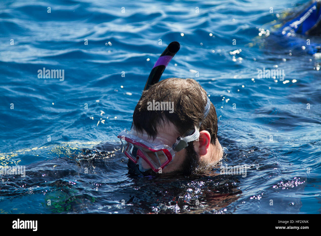 Jace Badia, a retired U.S. Army staff sergeant, floats in the water off