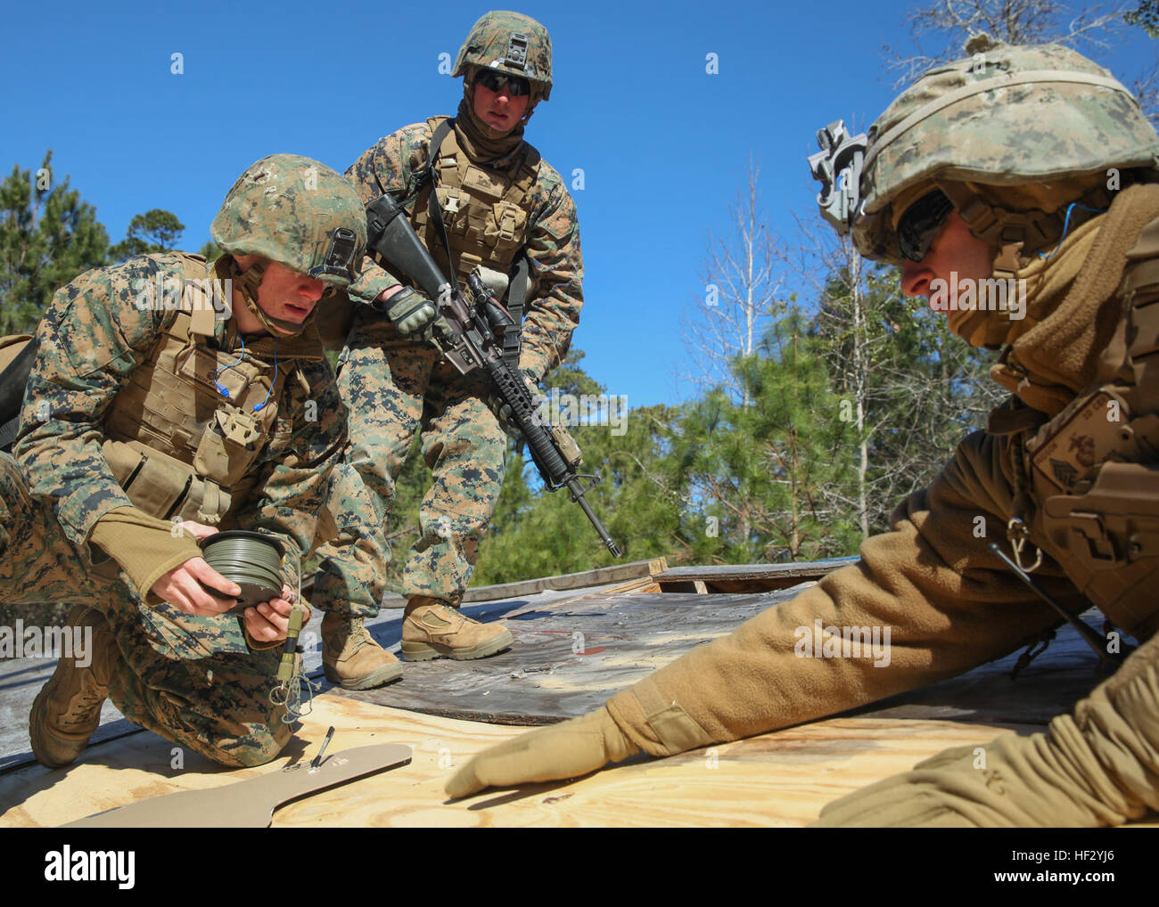 Marines with 2nd Combat Engineer Battalion set up an explosive charge