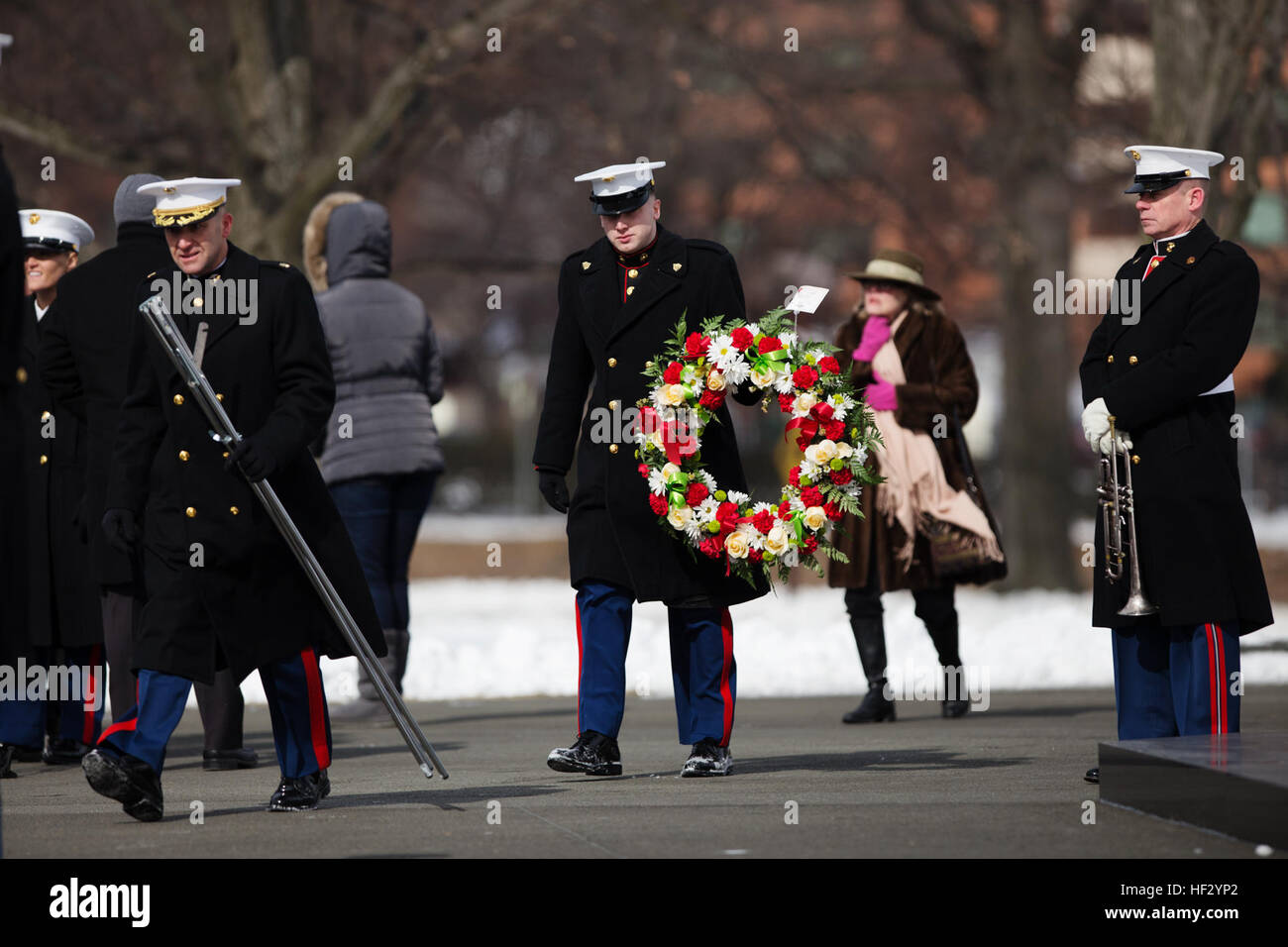 A Marine brings forth the ceremonial wreath during a rememberance ceremony at the Marine Corps War Memorial in Washington. The ceremony commemorated the 70th anniversary of the battle for Iwo Jima. With most of the surviving veterans in their 80’s and 90’s, surviving Marines visited the memorial in remembrance of their brothers in arms.  (U.S. Marine Corps photo by Cpl. Clayton Filiopwicz/Released) WWII Marine Veterans Remember Iwo Jima with Wreath Laying Ceremony 150219-M-LX723-004 Stock Photo