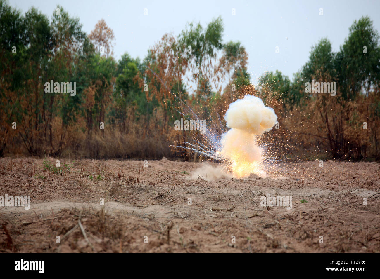 Unexploded ordnance is detonated by Royal Thai Air Force and U.S. Marine explosive ordnance disposal technicians during Exercise Cobra Gold 2015, Feb. The U.S. Marine EOD shared tactics and procedures on how to properly dispose unexploded ordnance to the RTAF. Exercise Cobra Gold demonstrates the commitment of the Kingdom of Thailand and the United States to our long-standing alliance and regional partnership to advance prosperity and security in the Asia-Pacific region. For more information on exercise Cobra Gold, please visit the official Facebook page at http://www.facebook.com/ExerciseCobr Stock Photo