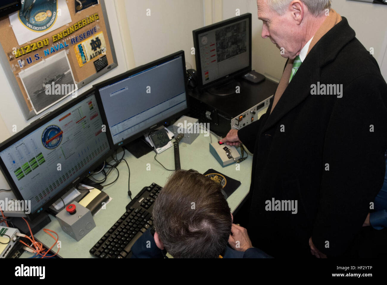 150220-N-LV331-002 - WASHINGTON (Feb. 20, 2015) Secretary of the Navy (SECNAV) Ray Mabus presses a button to fire a round out of a railgun from a control room at the Naval Research Laboratory. During his visit, Mabus spoke with project experts and observed ongoing innovations to electronic warfare systems, anti-submarine warfare projects and autonomous systems. (U.S. Navy photo by Mass Communication Specialist 2nd Class Armando Gonzales/Released) Naval Research Laboratory 150220-N-LV331-002 Stock Photo