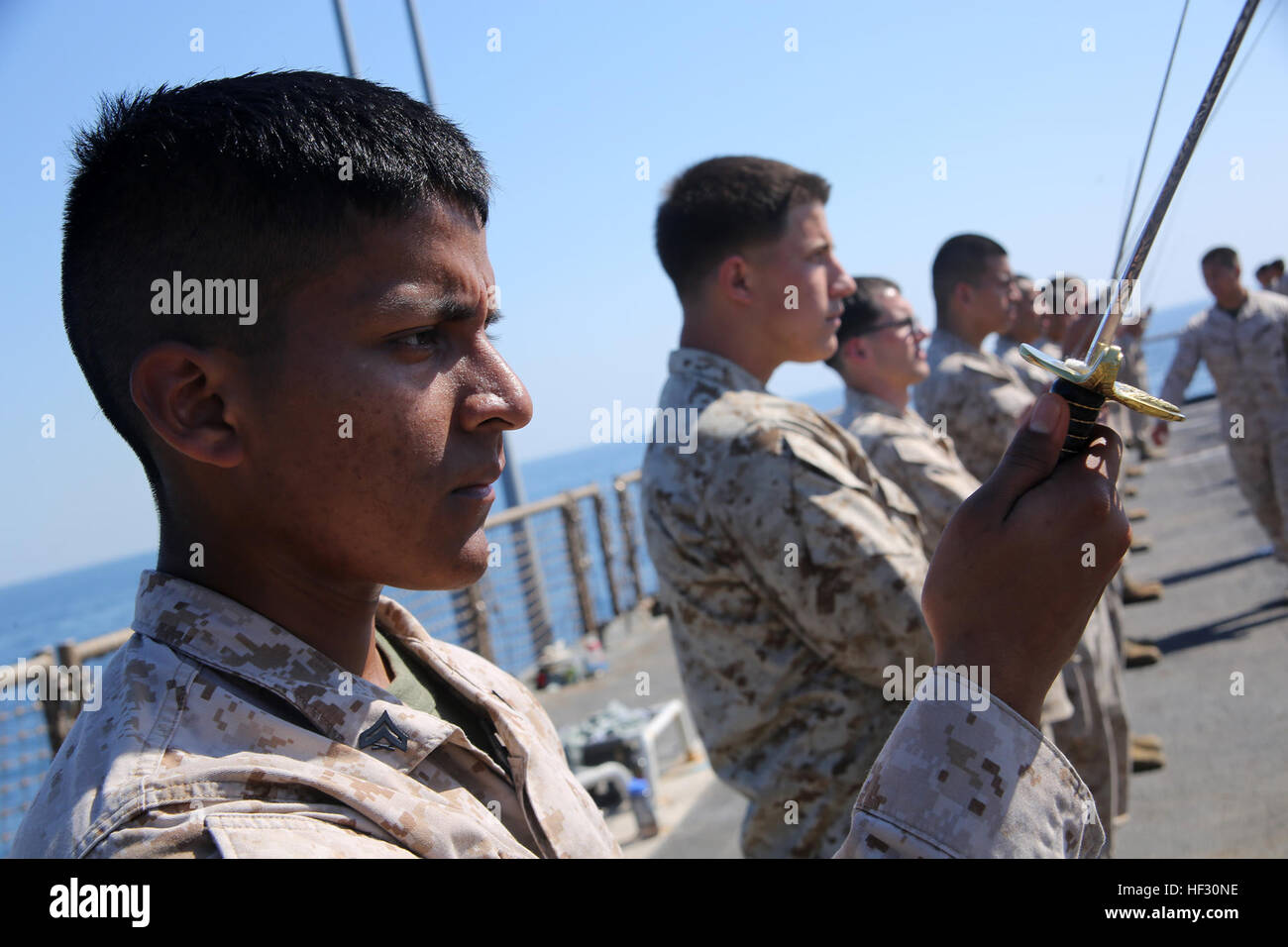 Corporal Juan A. Hernandez, a small arms technician with Combat Logistics  Battalion 24, 24th Marine Expeditionary Unit, conducts sword manual drills  during ...