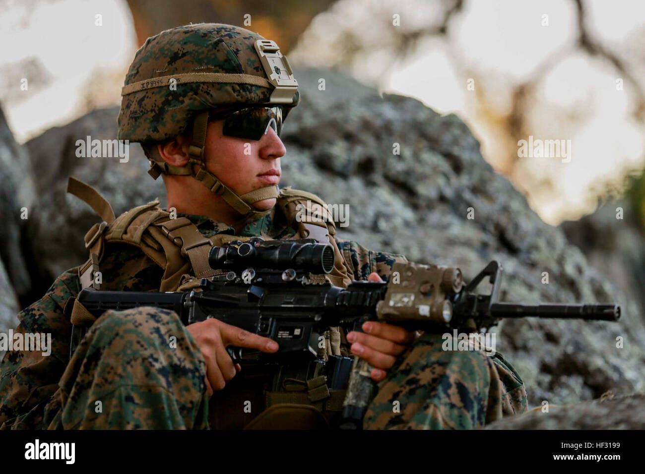 U.S. Marine Cpl. Trevor Perdue provides security during Amphibious Squadron/Marine Expeditionary Unit Integration Training (PMINT) aboard Camp Pendleton, Calif., March 5, 2015. Perdue is a team leader with Battalion Landing Team 3rd Battalion, 1st Marine Division, 15th Marine Expeditionary Unit.  The Marines of BLT 3/1 used PMINT to hone their skills in a field environment to improve their combat effectiveness as a unit.    (U.S. Marine Corps photo by Sgt. Jamean Berry/Released) 15th MEU Marines sharpen their combat skills 150305-M-GC438-172 Stock Photo