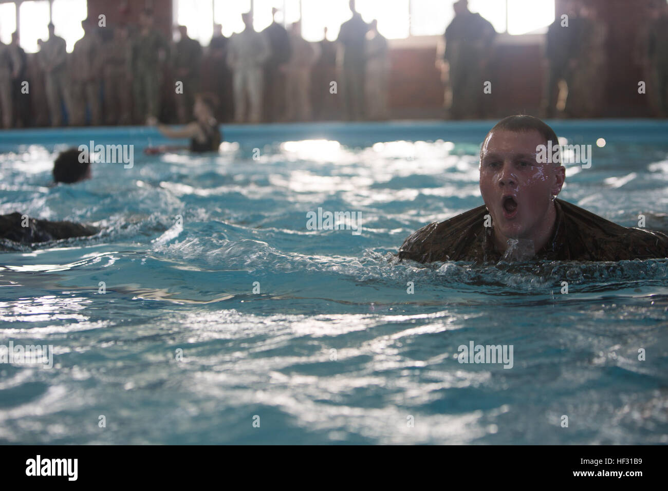 Corporal Daniel Wargo, a fire support man with 2nd Air Ground Liaison Company, performs a 25 meter swim during a swim qualification aboard Marine Corps Base Camp Lejeune, March 5, 2015. Marines have to get recertified in water survival every two years on active duty, or every three years if they pass the intermediate swim qualification. (Official Marine Corps photo by Cpl. Scott W. Whiting) Marines get their feet wet during swim qualification 150305-M-FD819-637 Stock Photo