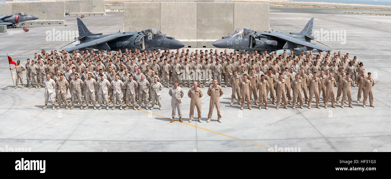 U.S. Marine Corps Marine Attack Squadron 211 (VMA-211) pose for a photograph in the Central Command Area of Responsibility, March 6, 2015. VMA-211 is deployed in support of Special Purpose Marine Air-Ground Task Force-Crisis Response-Central Command. (U.S. Marine Corps photo illustration by Cpl. Sean Searfus/Released) (This image was created using panoramic photo techniques) VMA-211 Squadron Photo 150308-M-VH365-001 Stock Photo