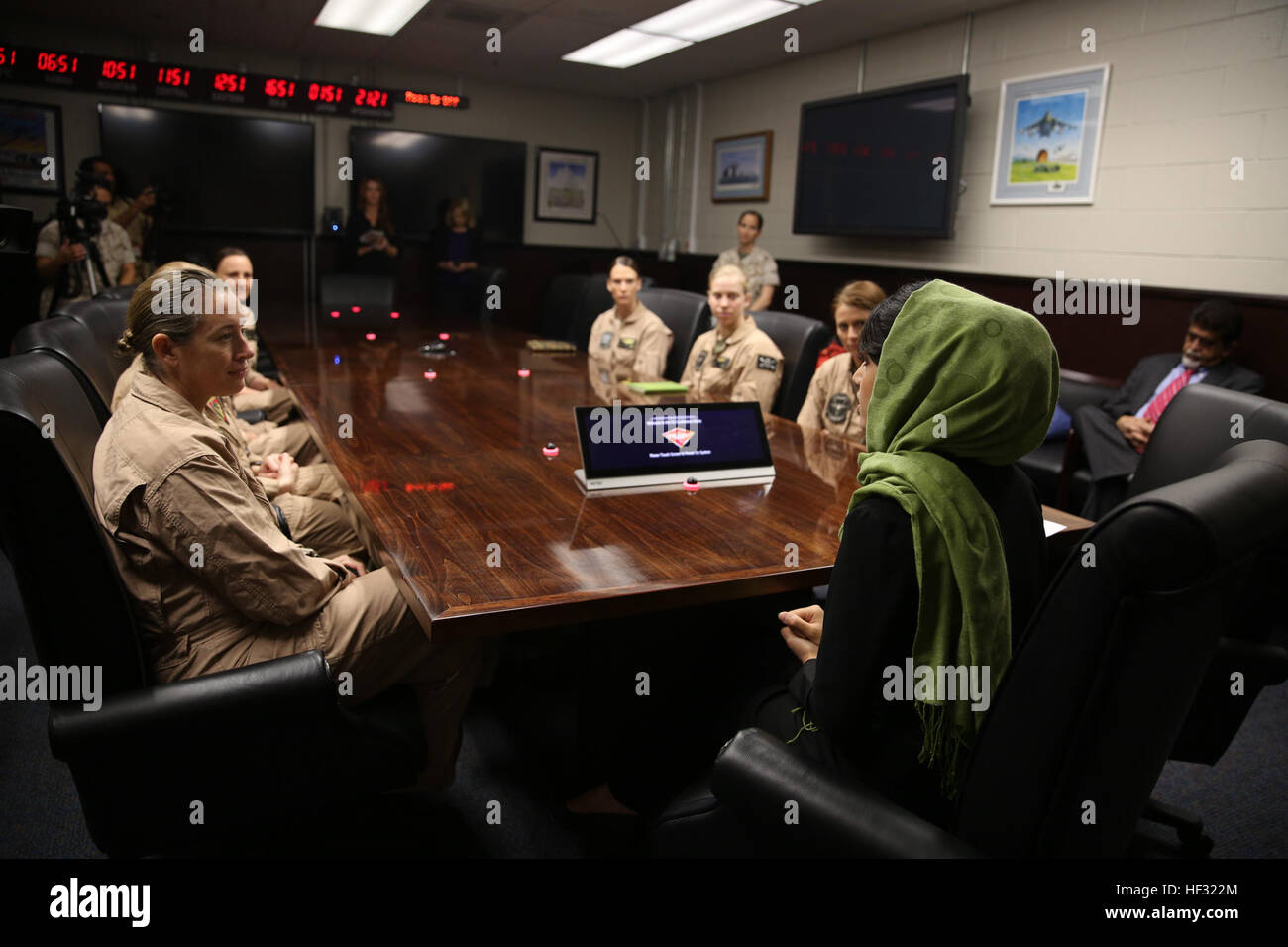 Captain Niloofar Rahmani, the first female fixed-wing pilot in the Afghan Air Force, speaks with female pilots who fly different aircraft aboard Marine Corps Air Station Miramar, Calif., March 9. Rahmani received the 2015 International Women of Courage award by the Department of state for her courage in advocating women’s rights despite personal risk. Awardee of the International Women of Courage visits 3rd MAW 150309-M-XW721-003 Stock Photo