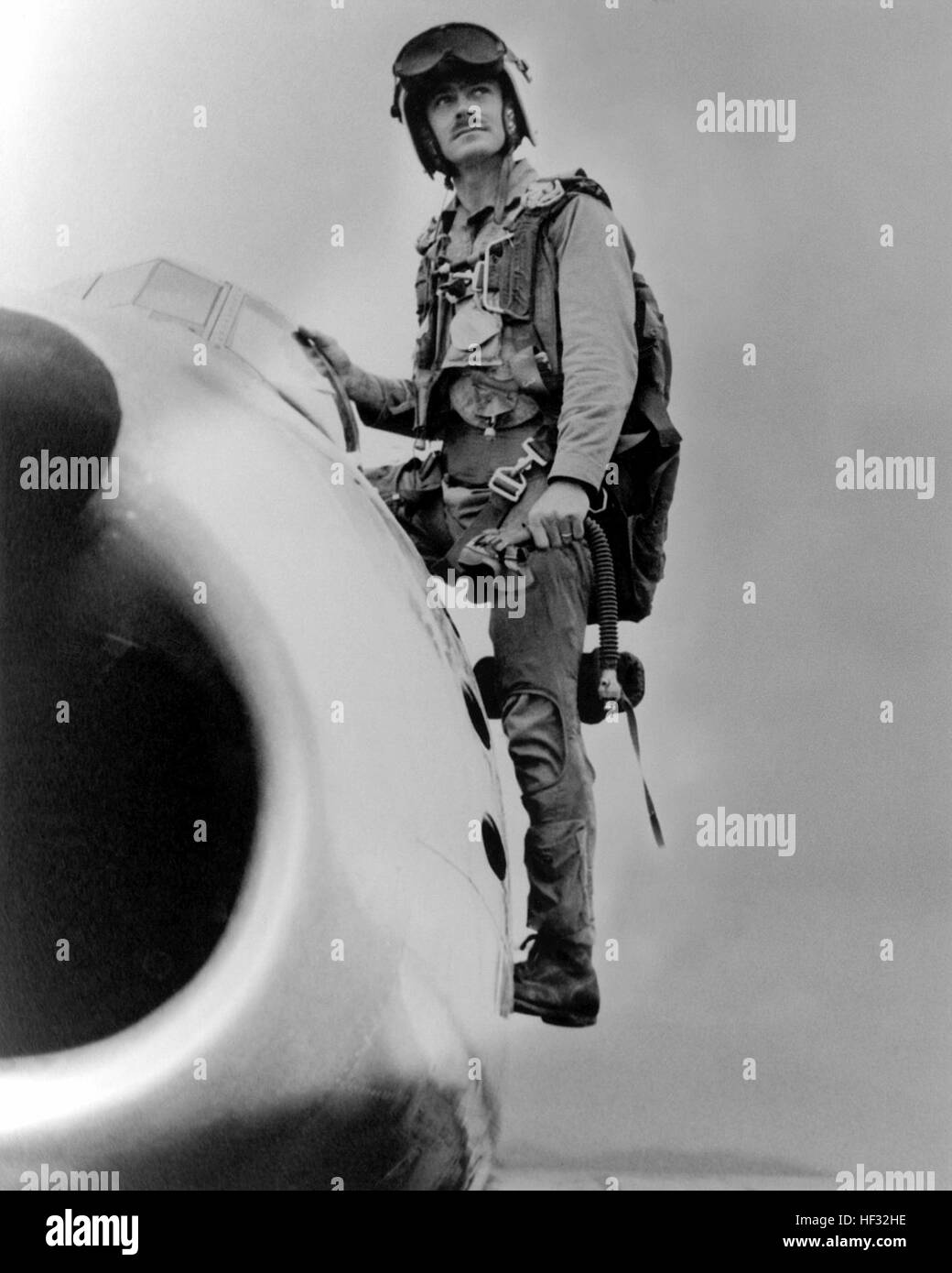 A Korean War era photograph of US Marine Corps (USMC) Major (MAJ) John F. Bolt, assigned to the 1st Marine Aircraft Wing, as he exits his USMC F-86 'SABER' jet aircraft. MAJ Bolt is the USMC first 'Jet Ace' credited with 6 kills, plus he shot down six Japanese planes during World War II (WWII). His hometown is Sanford, Florida.  (Exact date shot unknown) Photograph of U.S. Marine Corps Major John F. Bolt Stock Photo