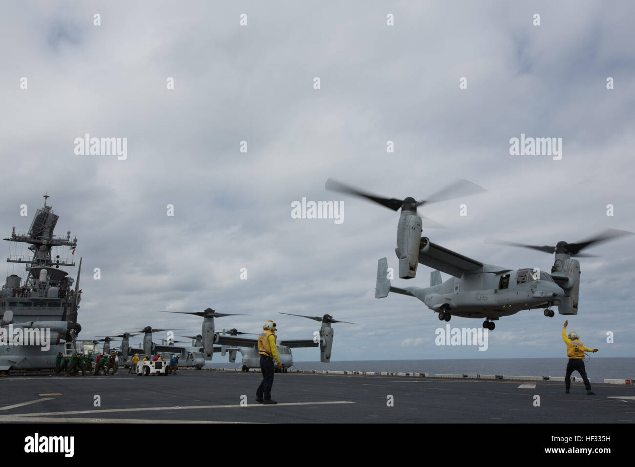 A U.S. Marine Corps MV-22B Osprey lifts off during flight operations on the USS Bonhomme Richard (LHD 6), at sea, March 14, 2015. The Ospreys are with Marine Medium Tiltrotor Squadron (VMM) 262 (Reinforced), 31st Marine Expeditionary Unit (MEU).  VMM-262 (REIN) is the aviation combat element for the 31st MEU. The 31st MEU is participating in amphibious integration training with the Bonhomme Richard Amphibious Ready Group during their Spring Patrol of the Asia-Pacific region. (U.S. Marine Corps photo by Staff Sgt. Joseph DiGirolamo/Released) Ospreys Transport Marines to Airfield Seizure Trainin Stock Photo