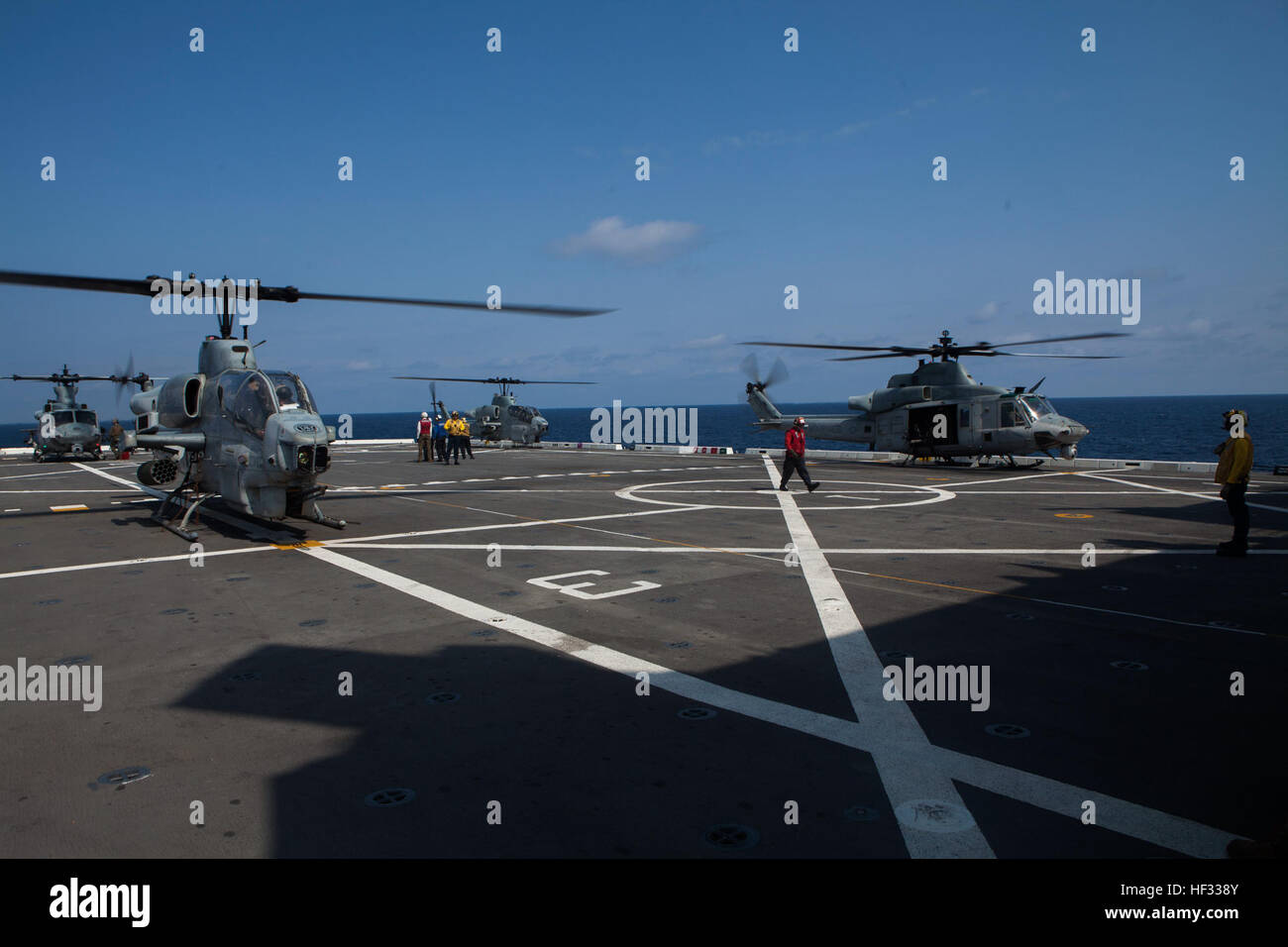 U.S. Marine Corps UH-1Y Hueys and AH-1 Super Cobras assigned to Marine Medium Tiltrotor Squadron 262 (Reinforced), 31st Marine Expeditionary Unit (MEU), prepare to take off from the flight deck of the USS Green Bay (LPD 20) while out at sea, March 11, 2015. The 31st MEU is currently conducting its Spring Patrol of the Asia-Pacific region. (U.S. Marine Corps photo by GySgt Ismael Pena/Released) VMM 262 (Rein) aboard the USS Green Bay 150314-M-CX588-034 Stock Photo
