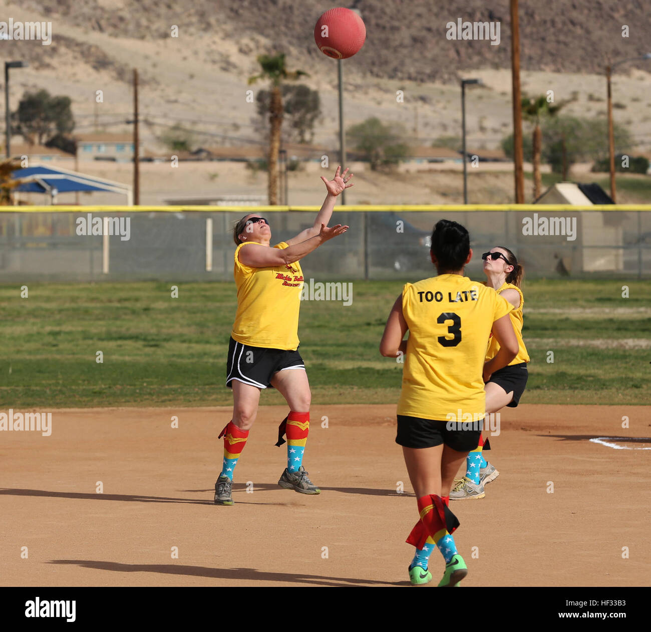 Kandi Hart, in-fielder, the First Ladies, catches the ball during a  spouses' kickball game at Felix Field March 15, 2015. This is the Spouses  of Twentynine Palms Area Kickball Association's first season