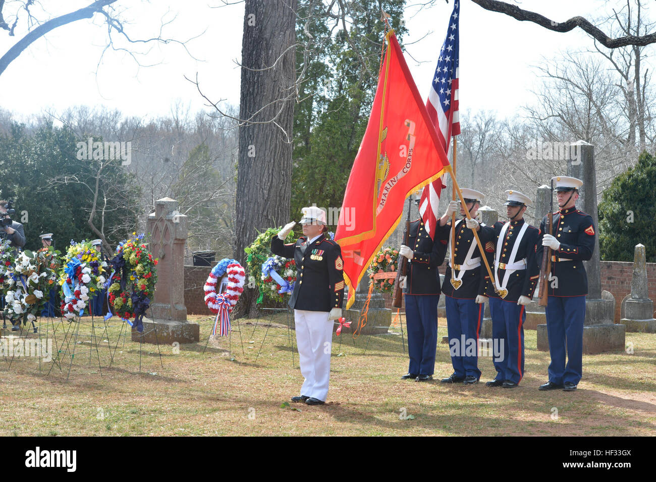 U.S. Marines with Marine Corps Base Quantico's Color Guard salute during the playing of the National Anthem at the Presidential wreath laying ceremony held at the final resting place of the 4th President of the United States, James Madison, also known as the Father of the Constitution, at his home at Montpelier, Orange, Va., March 16, 2015. This event was held in commemoration of the 264th anniversary of the birthdate of Madison, and has also been decreed as James Madison Appreciation Day for the Commonwealth of Virginia. (Official United States Marine Corps photo by Staff Sgt. Sarah R. Hickor Stock Photo