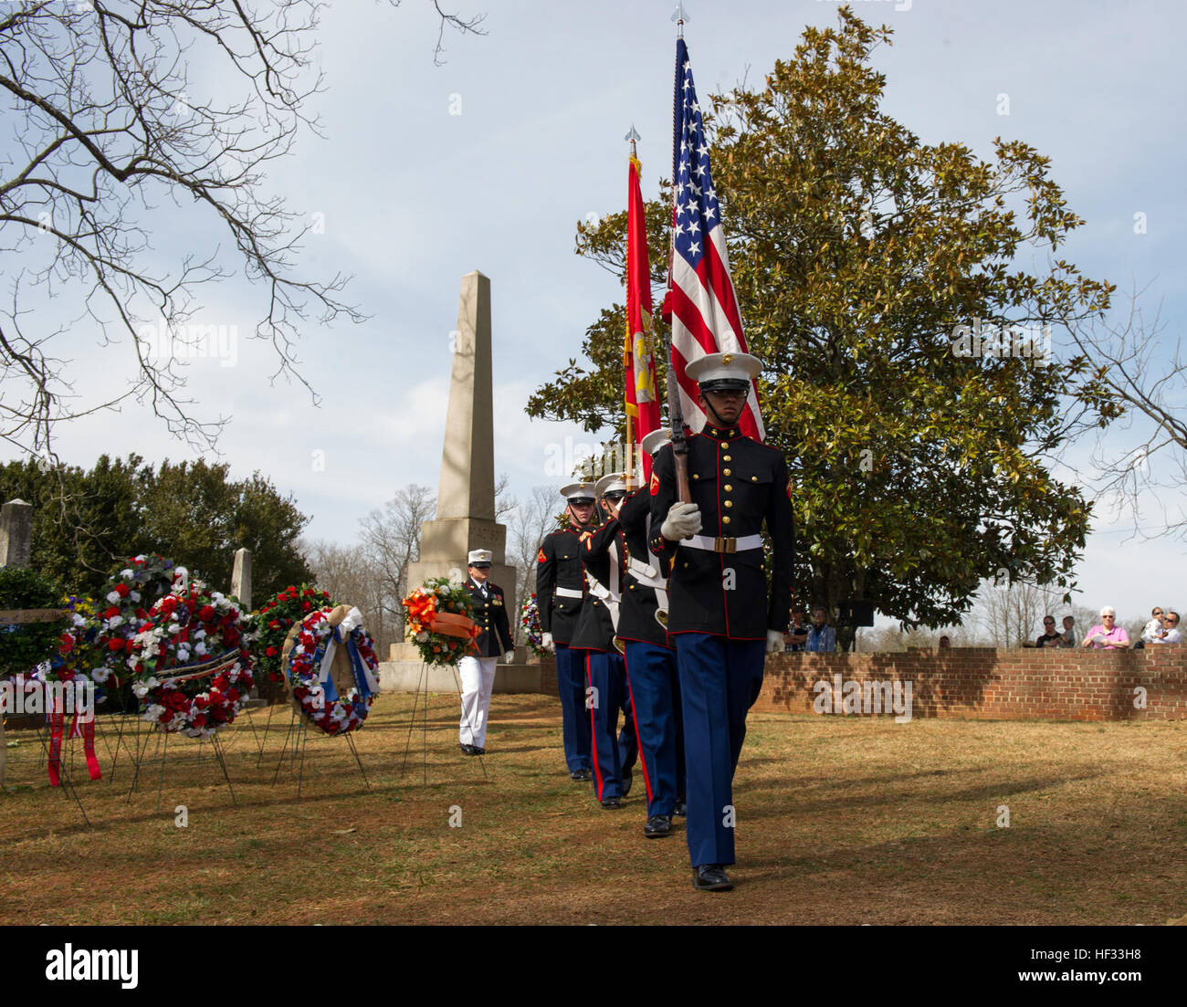 U.S. Marines with Marine Corps Base Quantico's Color Guard retire the Colors to close the Presidential wreath laying ceremony held at the final resting place of the 4th President of the United States, James Madison, also known as the Father of the Constitution, at his home at Montpelier, Orange, Va., March 16, 2015. This event was held in commemoration of the 264th anniversary of the birthdate of Madison, and has also been decreed as James Madison Appreciation Day for the Commonwealth of Virginia. (Official United States Marine Corps photo by Kathy Reesey/Released) Madison Wreath Laying Ceremo Stock Photo