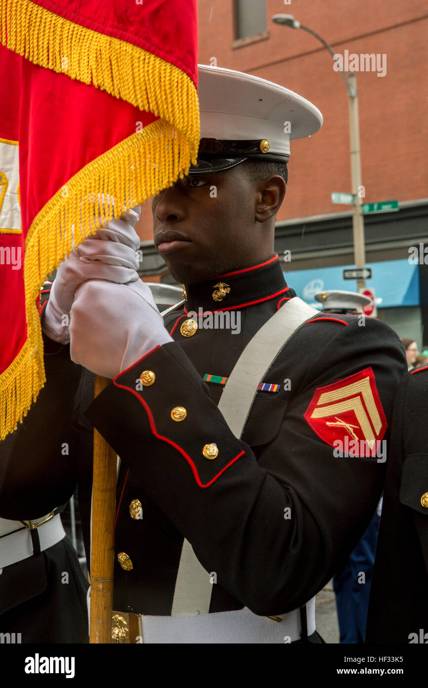 U.S. Marines with Marine Corps Forces Command, 2D Marine Logistics Group, and 2D Marine Division, participate in the South Boston Allied War Veteran's Council St. Patrick's Day parade, South Boston, Massachusetts, March 16, 2015. The Marines arrived via the USS Arlington (LPD-24) amphibious transport dock ship from Norfolk, Virginia, to South Boston to conduct tours aboard the ship to the general public and to participate in community relations events. (U.S. Marine Corps photo by Cpl. Desire M. Mora/ Released) U.S. Marines march in the South Boston Allied War Veteran's Council St. Patrick's Da Stock Photo