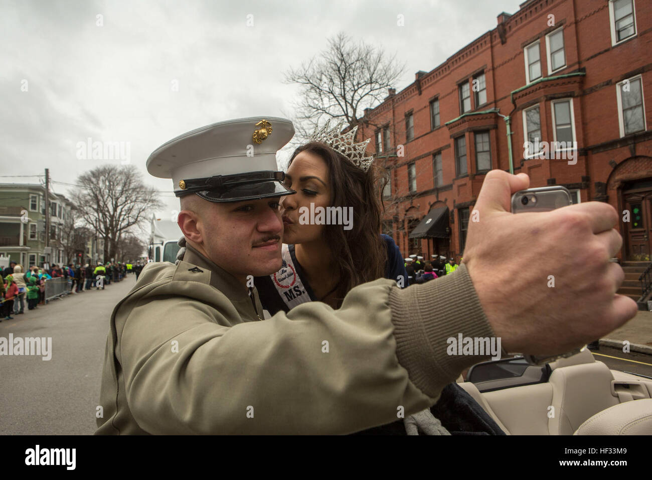 U.S. Marines with Marine Corps Forces Command, 2D Marine Logistics Group, and 2D Marine Division, participate in the South Boston Allied War Veteran's Council St. Patrick's Day parade, South Boston, Massachusetts, March 16, 2015. The Marines arrived via the USS Arlington (LPD-24) amphibious transport dock ship from Norfolk, Virginia, to South Boston to conduct tours aboard the ship to the general public and to participate in community relations events. (U.S. Marine Corps photo by Cpl. Desire M. Mora/ Released) U.S. Marines march in the South Boston Allied War Veteran's Council St. Patrick's Da Stock Photo