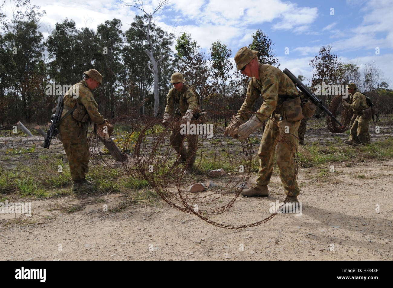 Australian Army Soldiers From The 1St Combat Engineer Regiment Lay Barbed  Wire During Exercise Talisman Sabre 2009 In Queensland, Australia, July 9,  2009. Talisman Sabre Is A Biennial Combined Training Activity Designed