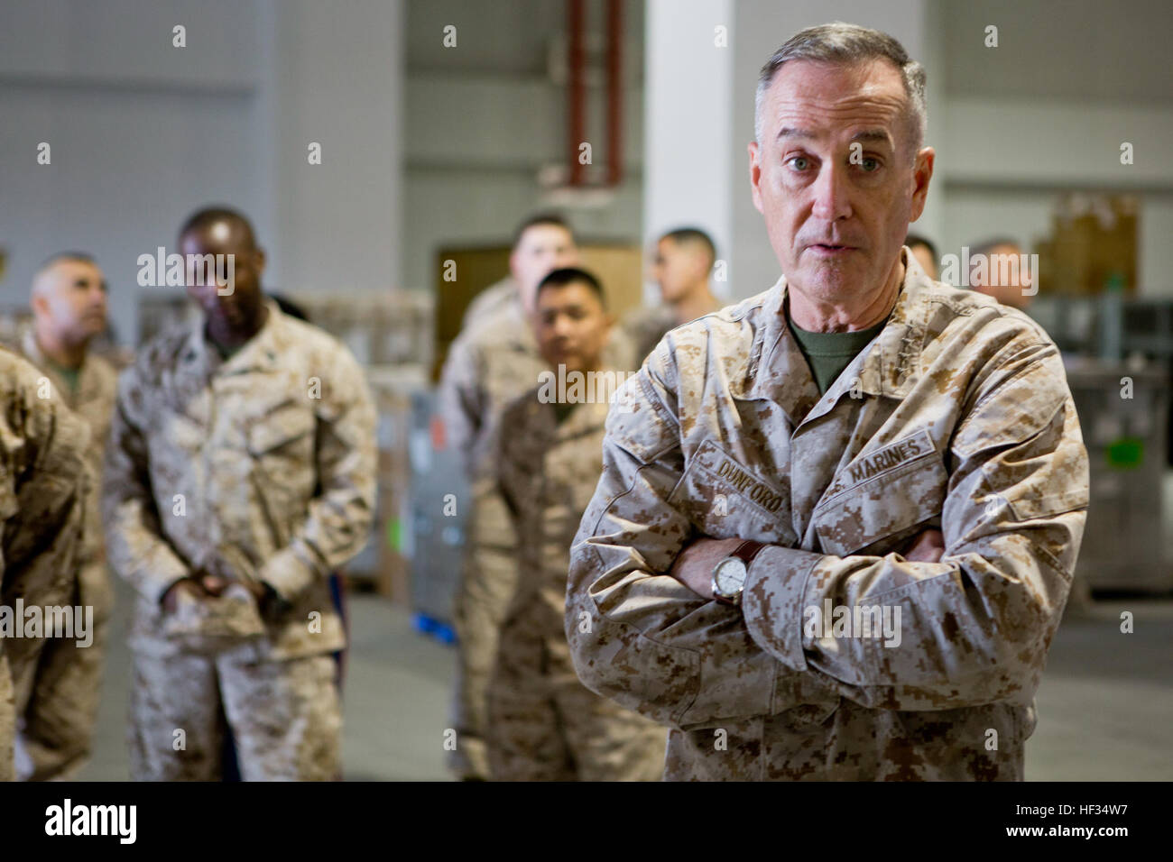 Gen. Joseph Dunford, Commandant of the Marine Corps, and Sgt. Maj. Ronald Green, Sergeant Major of the Marine Corps, paid a visit to the service members aboard Marine Corps Air Station Iwakuni, Japan, March 24, 2015. During their visit, Dunford and Green conducted an all-hands brief and toured some of the units aboard station including Marine All-Weather Fighter Attack Squadron 242 and Marine Aviation Logistics Squadron 12. Dunford also spoke to service members about the issues pertaining to the current state of the Marine Corps and his plans to improve it while fielding questions the service  Stock Photo