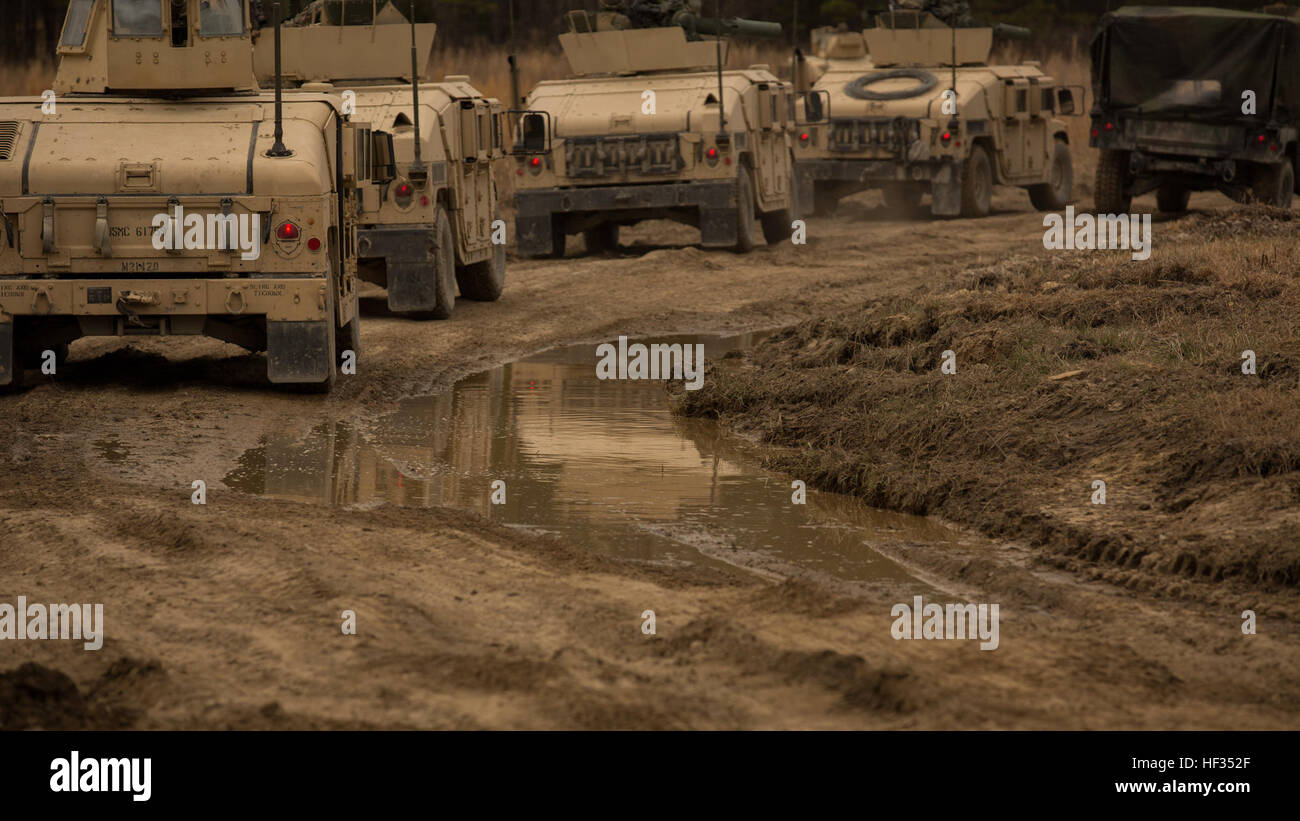 Marines with 2nd Tank Battalion, 2nd Marine Division, arrive at the Tactical Assembly Area in Humvees and begin to setup security before nightfall during their Marine Corps Combat Readiness Evaluation aboard Fort Pickett, Va., March 25, 2015. A TAA is used to prepare the unit for future combat operations. It allows the unit to regroup, organize and develop a plan of attack. (U.S. Marine Corps photo by Cpl. Justin T. Updegraff/Released) On the move, 2nd Tank Battalion conducts tactical road march 150325-M-TV331-062 Stock Photo