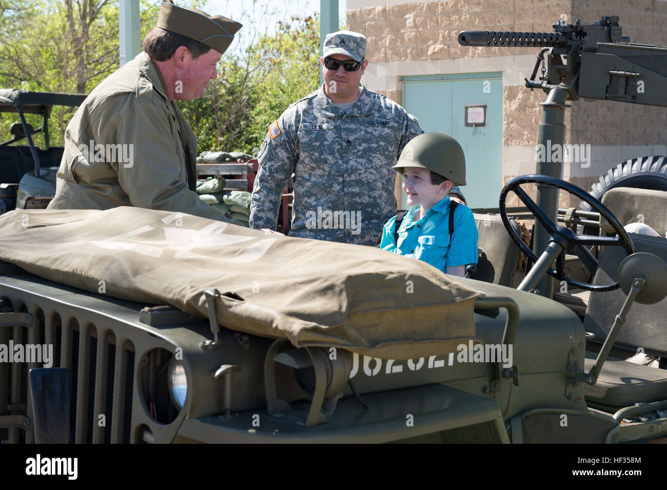 Honorary enlistee Rowan Windham takes a ride on vintage WWII Jeep