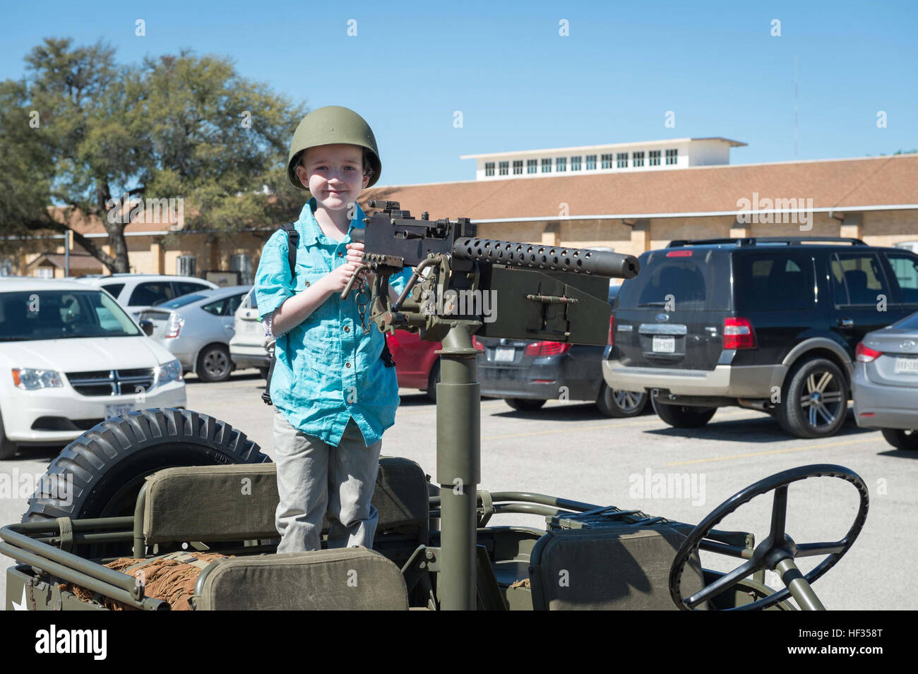 Honorary enlistee Rowan Windham takes a ride on vintage WWII Jeep