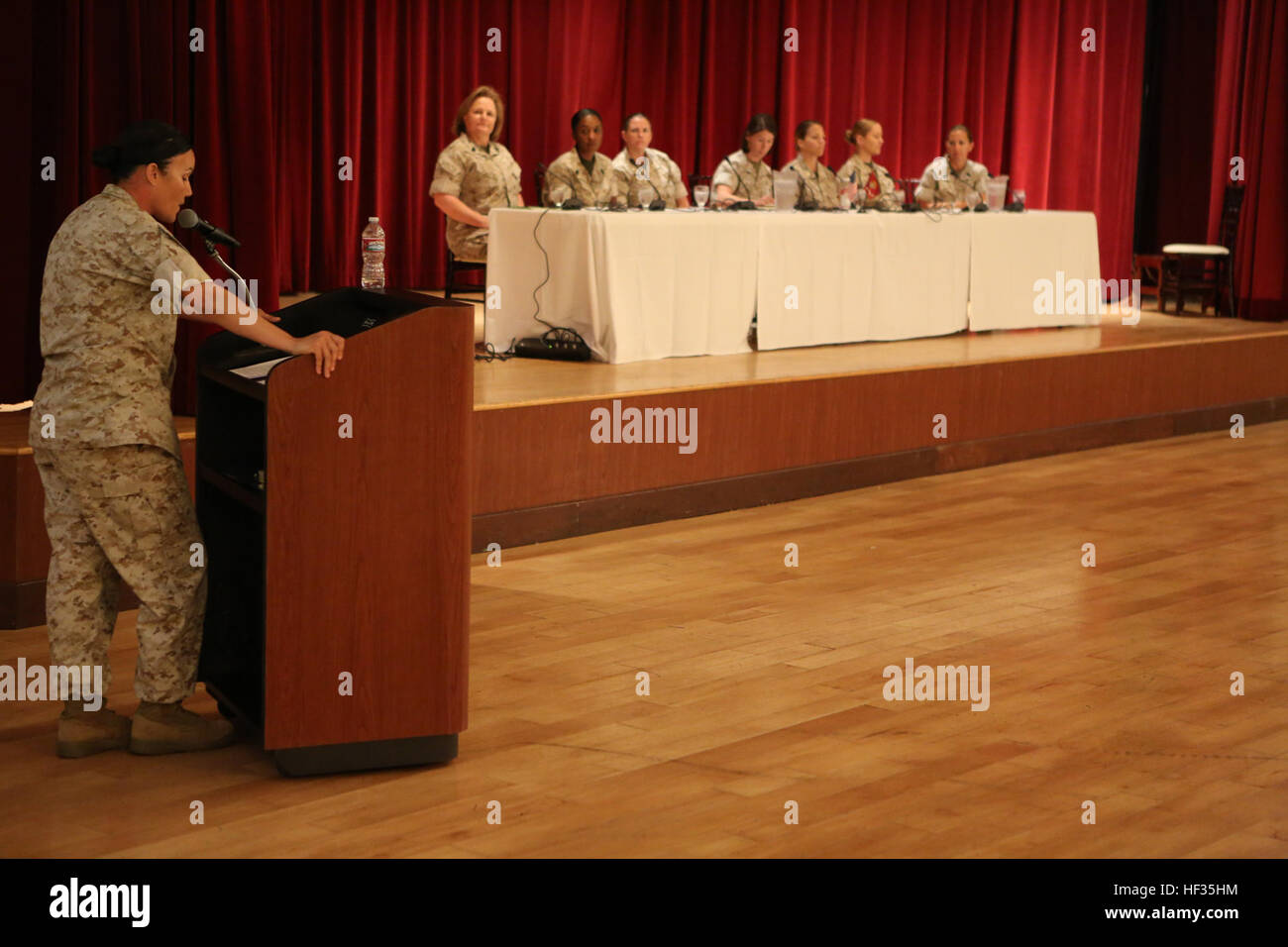 Master Sgt. Bonnie Diaz, a Marine with I Marine Expeditionary Force Headquarters Group Command Element, speaks to panel members at a women’s leadership symposium aboard Marine Corps Base Camp Pendleton, Calif., March 30, 2015. The symposium gave junior Marines a chance to speak to prominent military leaders to discuss gender equality and other topics. WomenE28099s leadership symposium discusses gender equality in the Corps 150330-M-LS369-005 Stock Photo