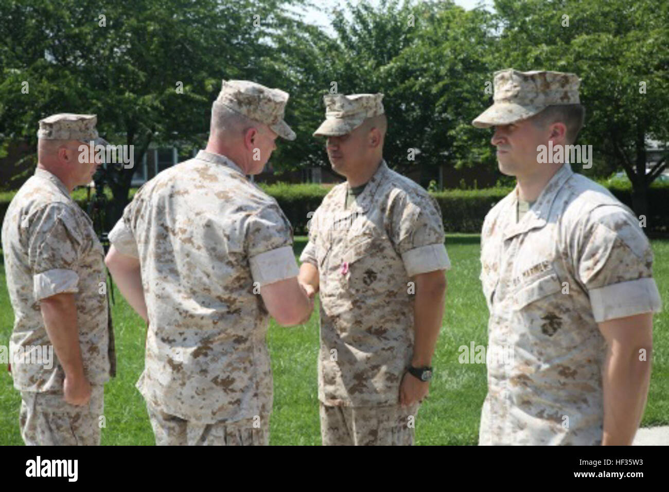 U.S. Marine Corps Chief Warrant Officer 4 Michael Franks (left), a ...