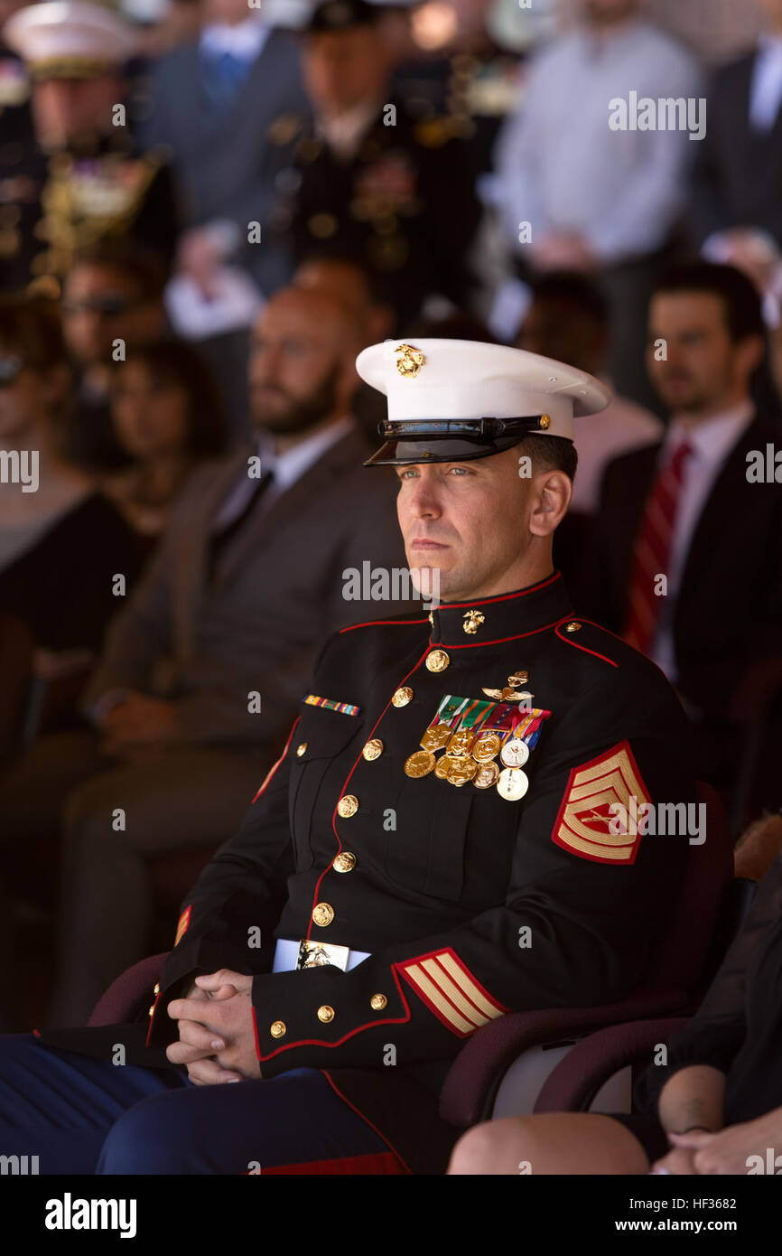 U.S. Marine Corps Gunnery Sergeant Brian C. Jacklin, Team Chief, Delta Company, 1st Marine Special Operations Battalion, United States Marine Corps Forces Special Operations Command, sits in the audience during the presentation of the Navy Cross Medal and Bronze Star Medal Ceremony for him and five members of Marine Special Operations Team 8131 at Camp Pendleton, Calif., April 9, 2015. On June 14, 2012, while deployed to Afghanistan, the Marine Special Operations Team 8131 simultaneously conducted counterattacks against the enemy, established village stability and evacuation of two Marine casu Stock Photo