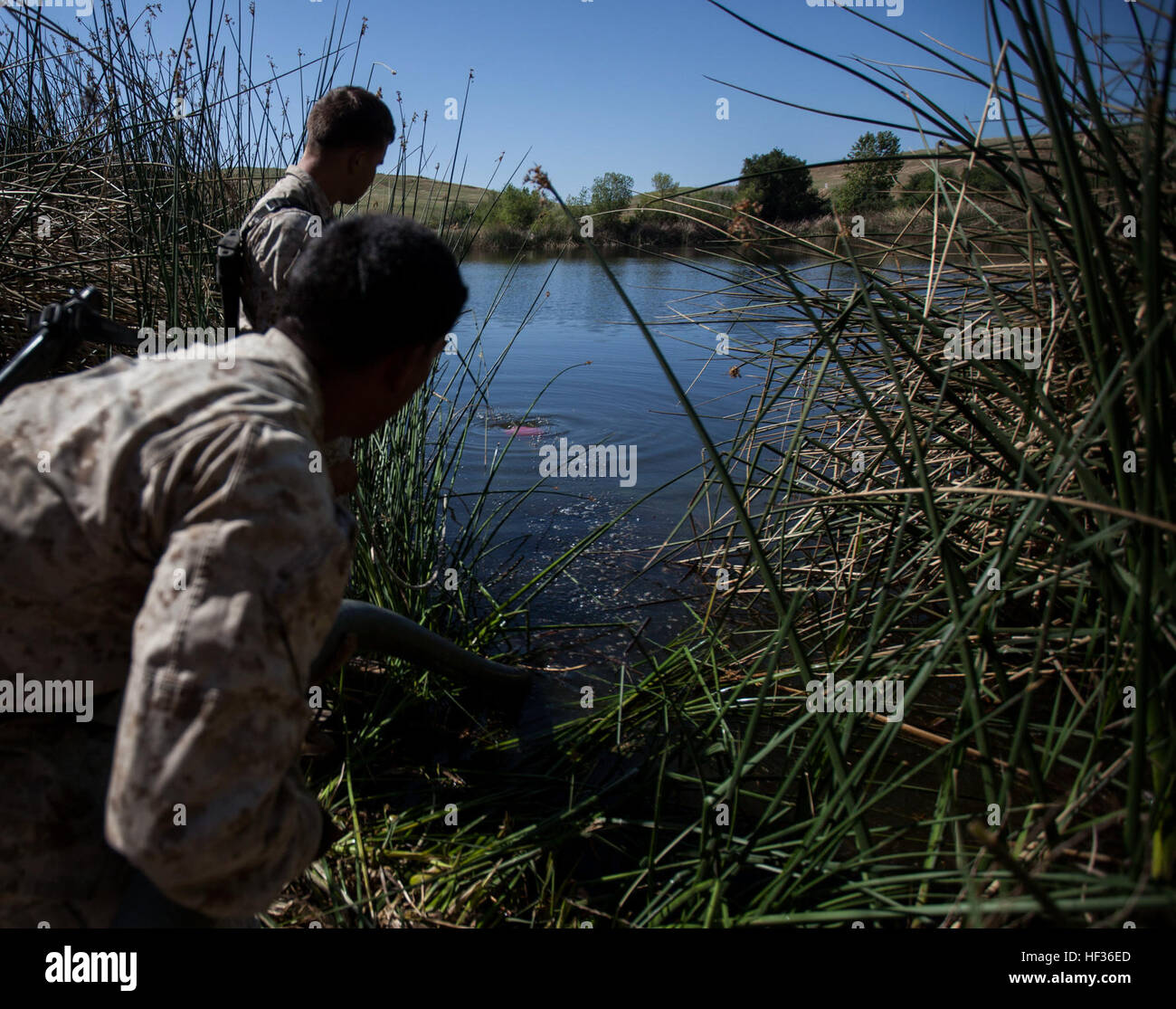 U.S. Marines with Combat Logistics Battalion 15, 15th Marine Expeditionary Unit, adjust piping for a water purification project to support a simulated foreign humanitarian assistance mission during Certification Exercise (CERTEX) aboard Camp Pendleton, Calif., April 11, 2015. The 15th MEU’s combat logistics element tested their skills to provide humanitarian assistance and engineering support such as water purification. (U.S. Marine Corps photo by Cpl. Elize McKelvey/Released) CLB-15 trains for foreign humanitarian assistance missions 150411-M-JT438-034 Stock Photo