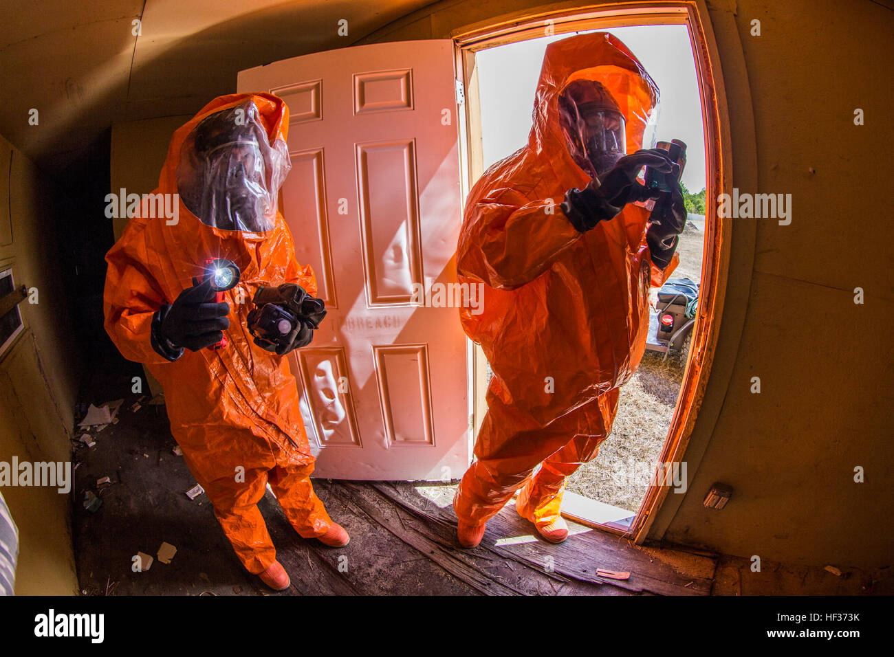 Strike Team members with the 21st Weapons of Mass Destruction Civil Support Team (WMD CST), New Jersey National Guard investigate a suspicious site during a full-scale Homeland Response Force exercise involving units from the New Jersey and New York Army and Air National Guard at Joint Base McGuire-Dix-Lakehurst, N.J., April 16, 2015. The Chemical, Biological, Radiological and Nuclear (CBRN) portion of the exercise was performed by National Guard Soldiers and Airmen from New Jersey’s 21st Weapons of Mass Destruction Civil Support Team and New York’s 2nd Weapons of Mass Destruction Civil Suppor Stock Photo